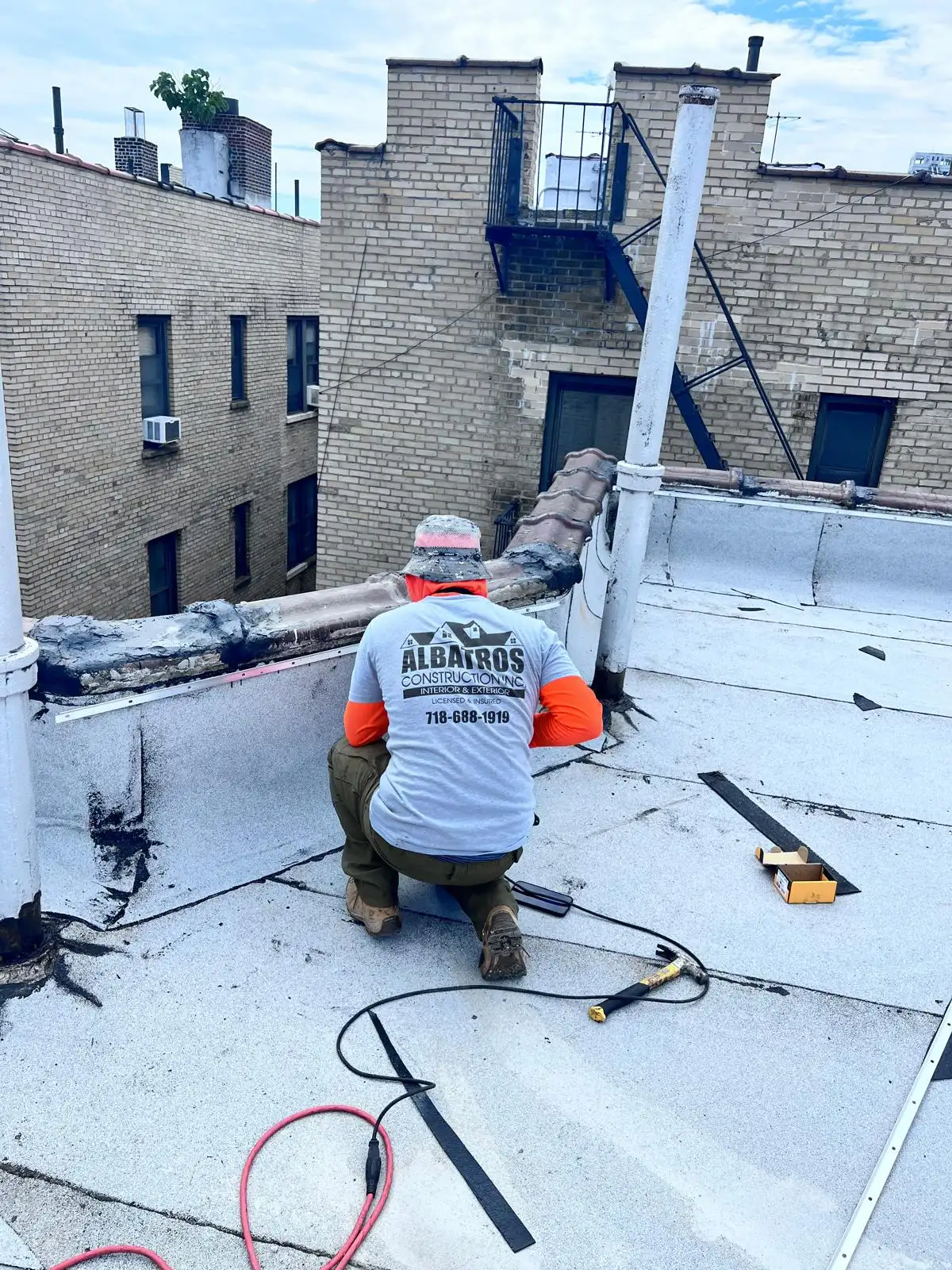 Albatros roofer torching seams — Washington Heights, Manhattan