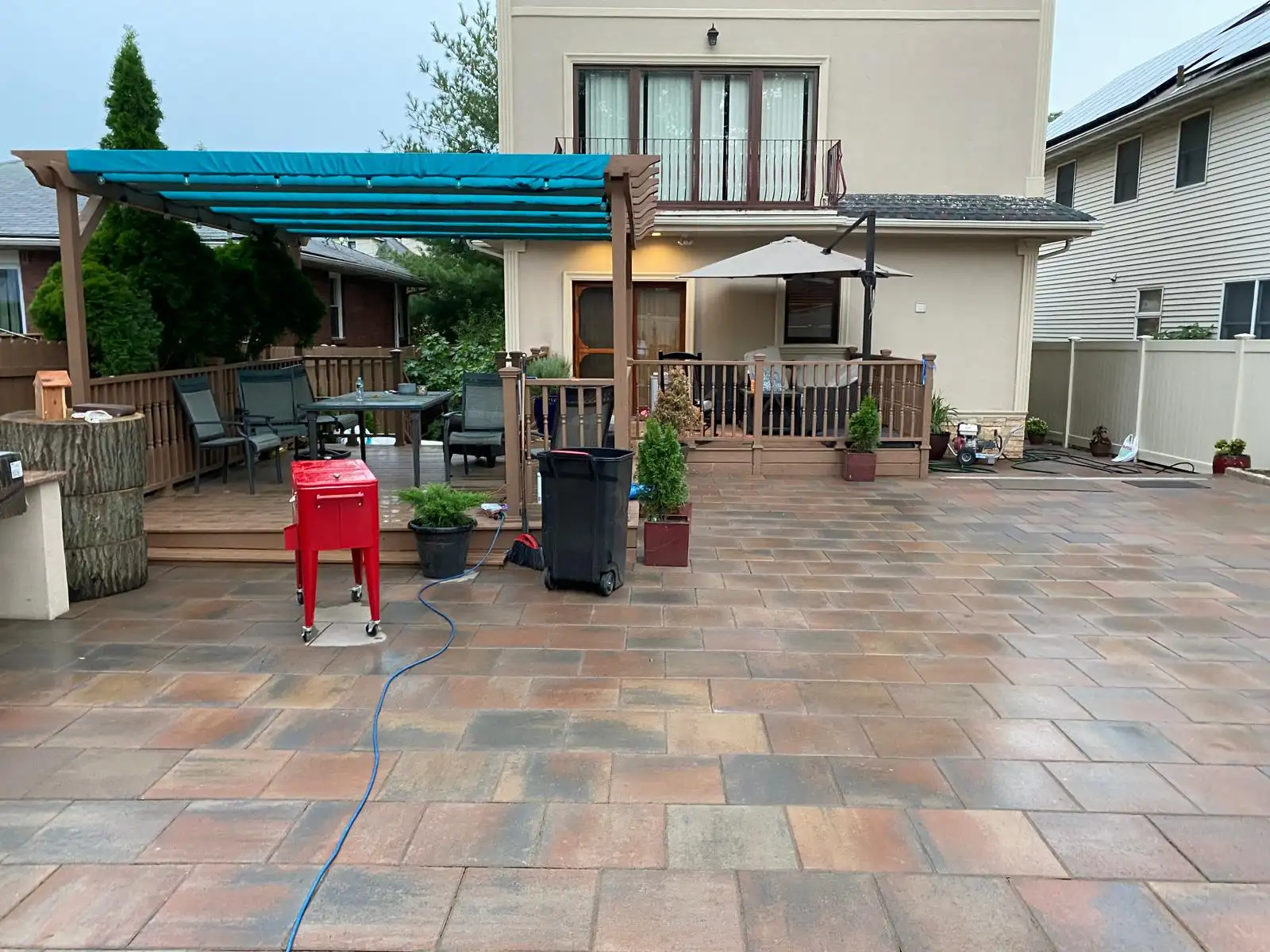 Backyard patio with shade sail — Arrochar, Staten Island