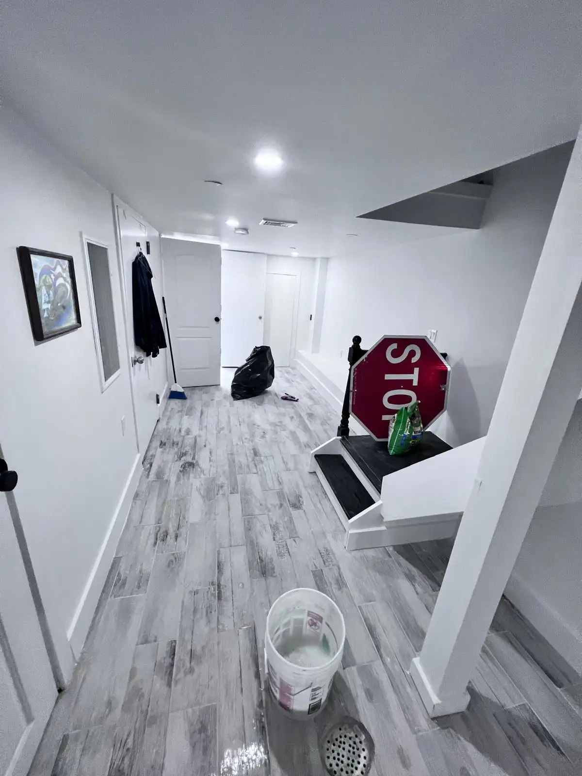 Basement hallway after drywall repair — Bedford-Stuyvesant, Brooklyn