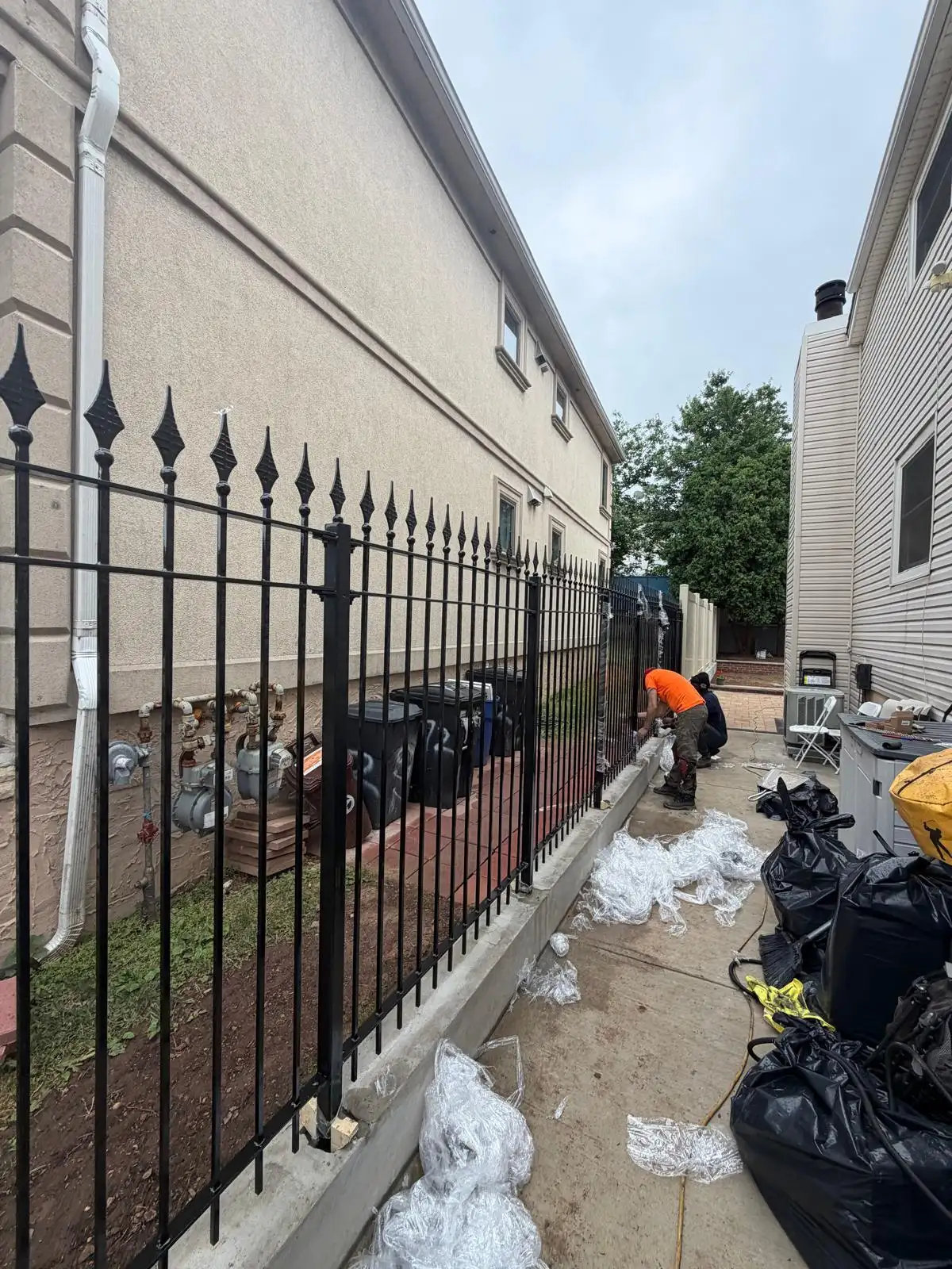 Black metal fence along side yard — Emerson Hill, Staten Island