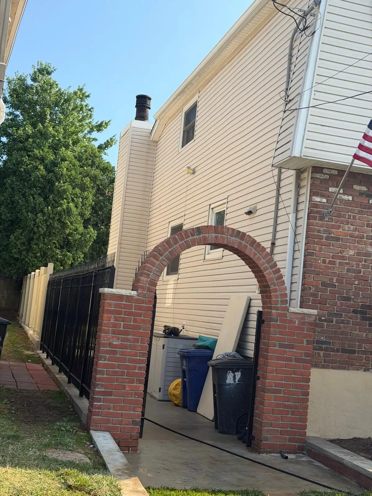 Brick arch gate at side yard — Emerson Hill, Staten Island
