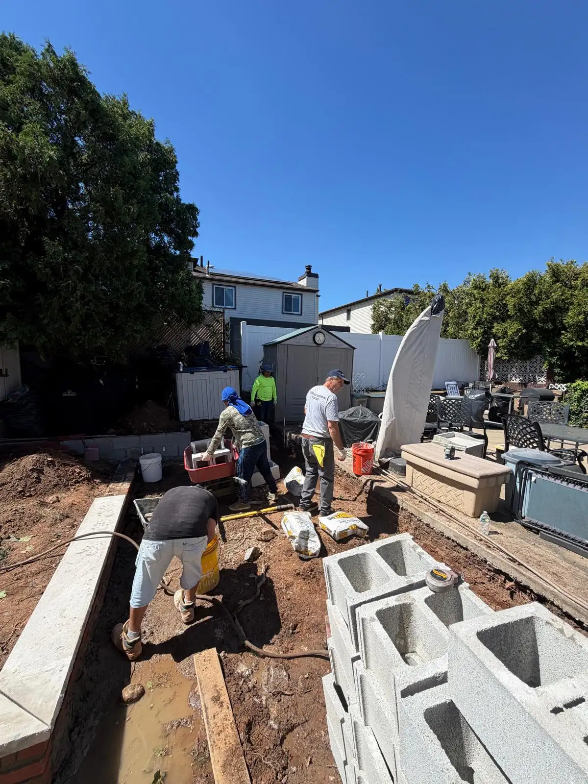 Building cinder block retaining wall — Emerson Hill, Staten Island