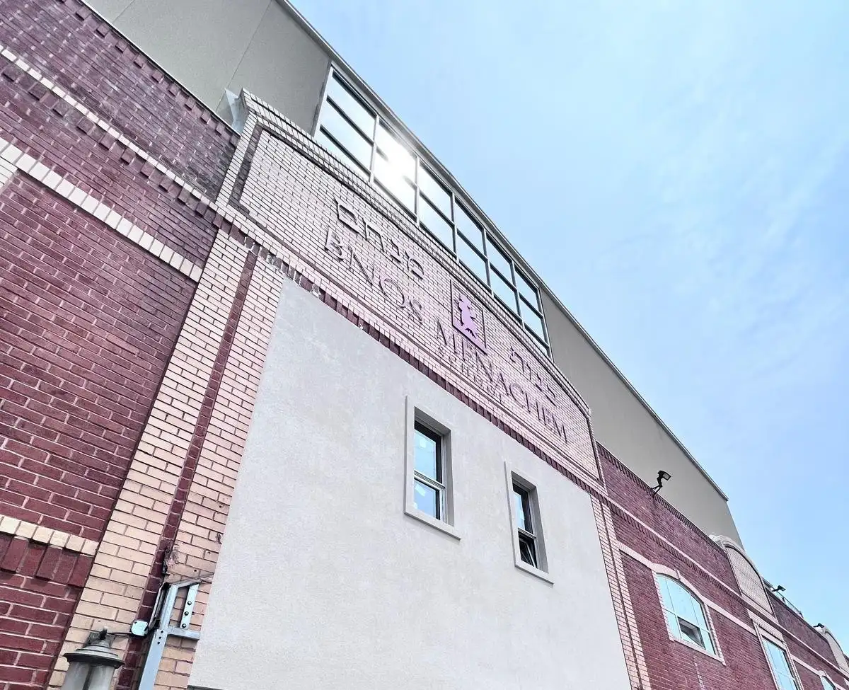 Completed stucco facade — Crown Heights, Brooklyn