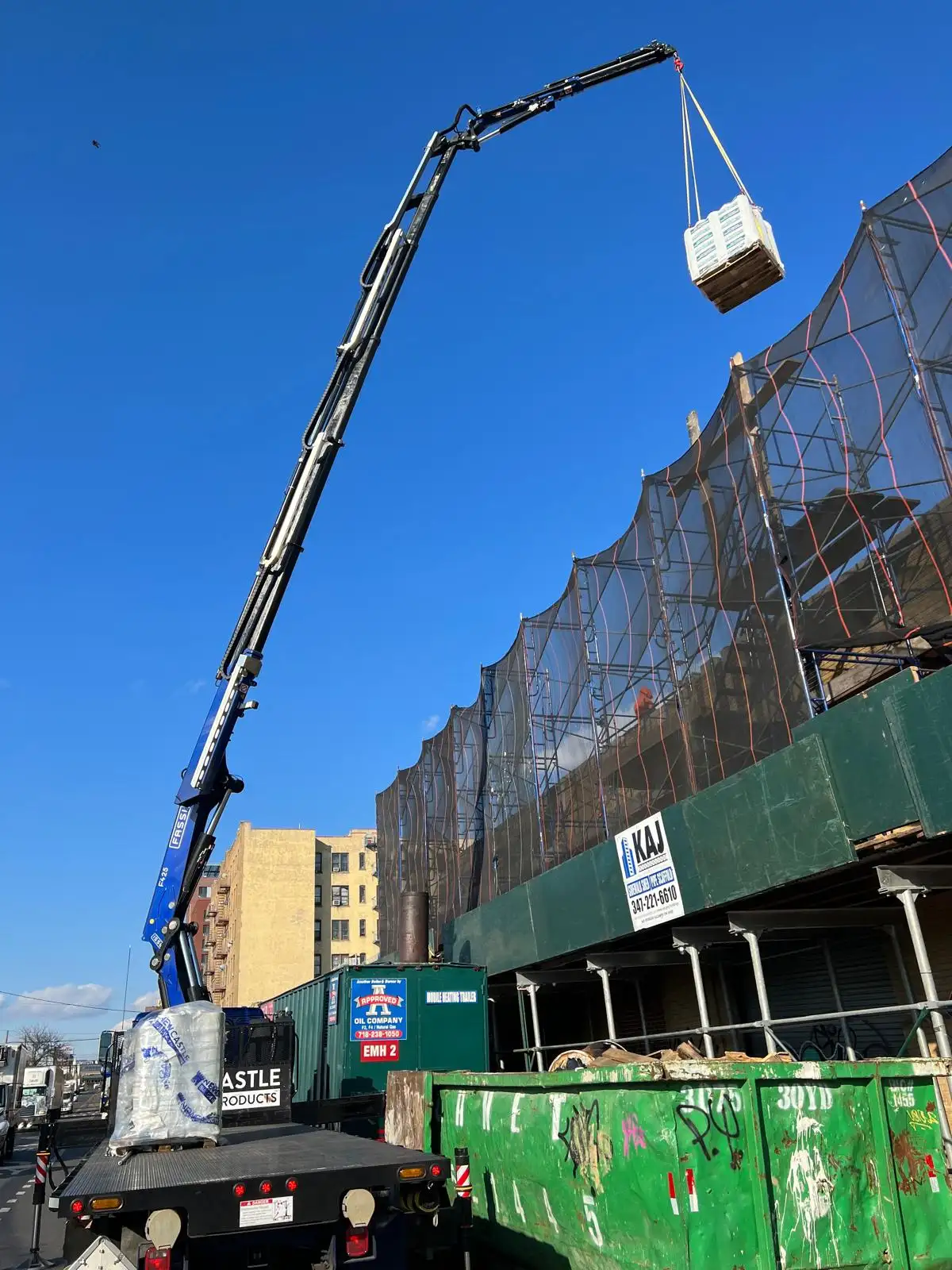 Crane hoisting materials to roof — Hunts Point, Bronx