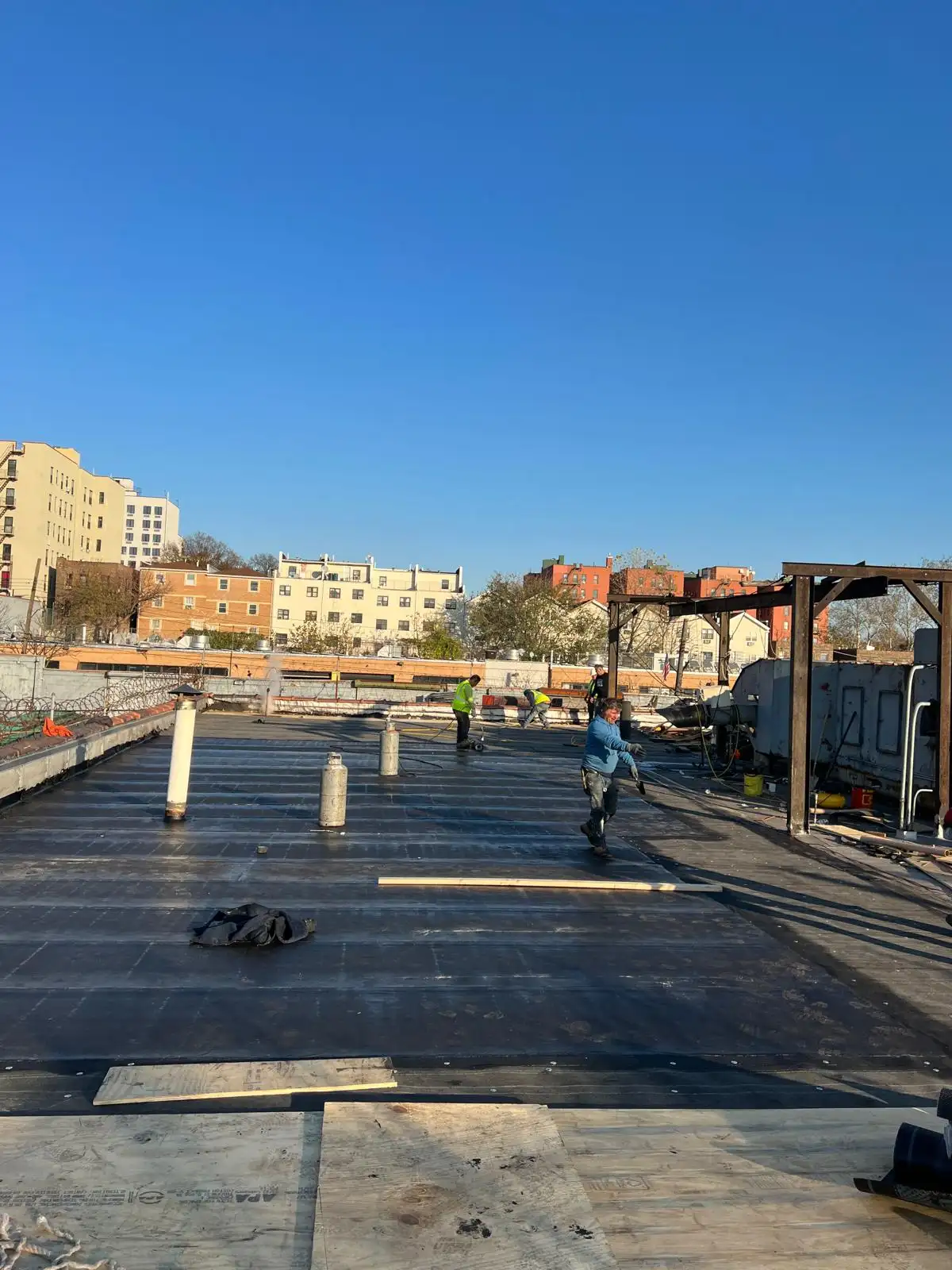 Crew completing roof — Hunts Point, Bronx