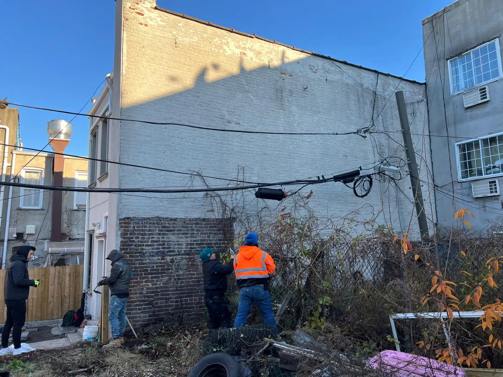 Crew in rear yard — East New York, Brooklyn