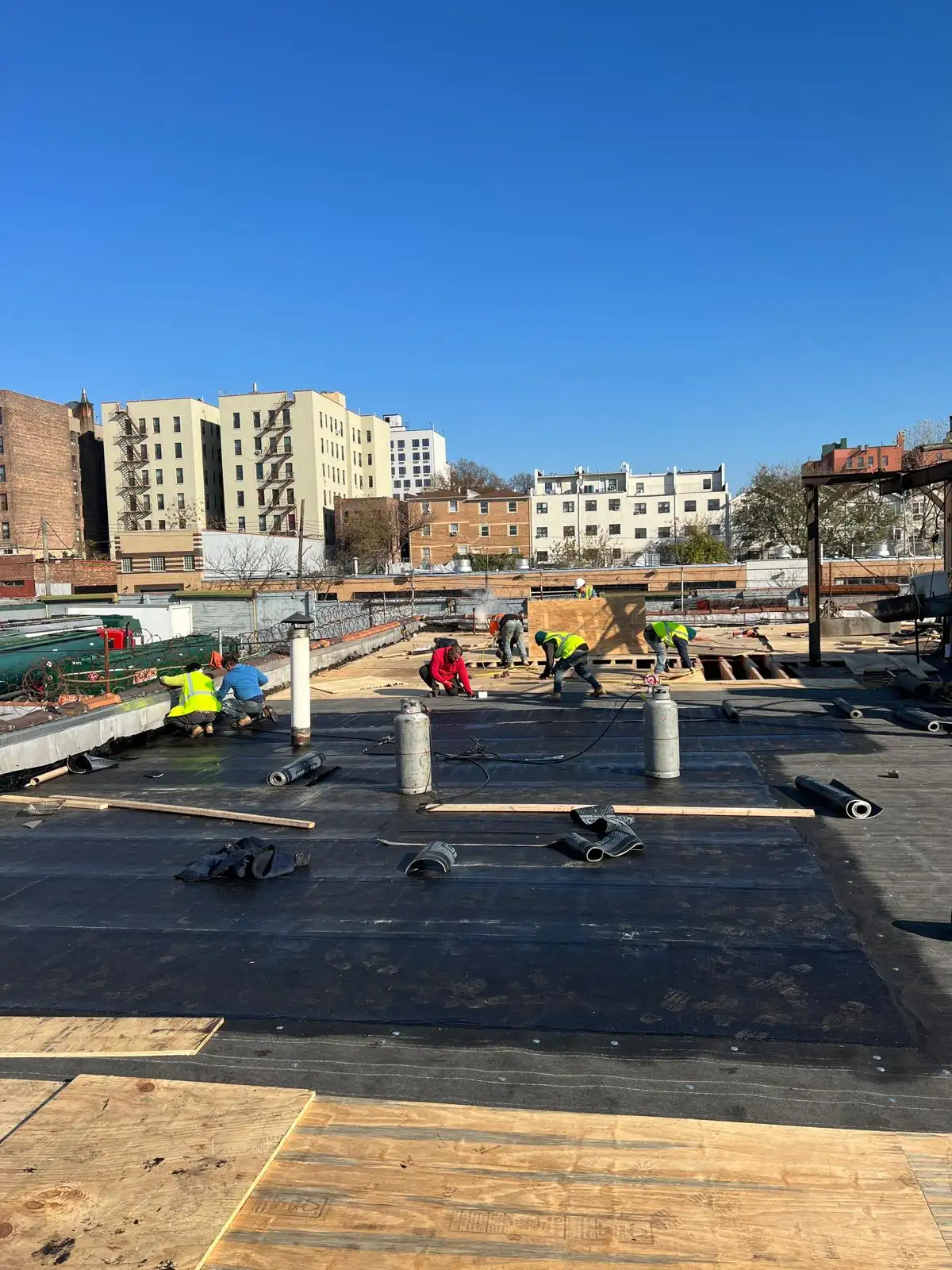Crew on factory roof — Hunts Point, Bronx