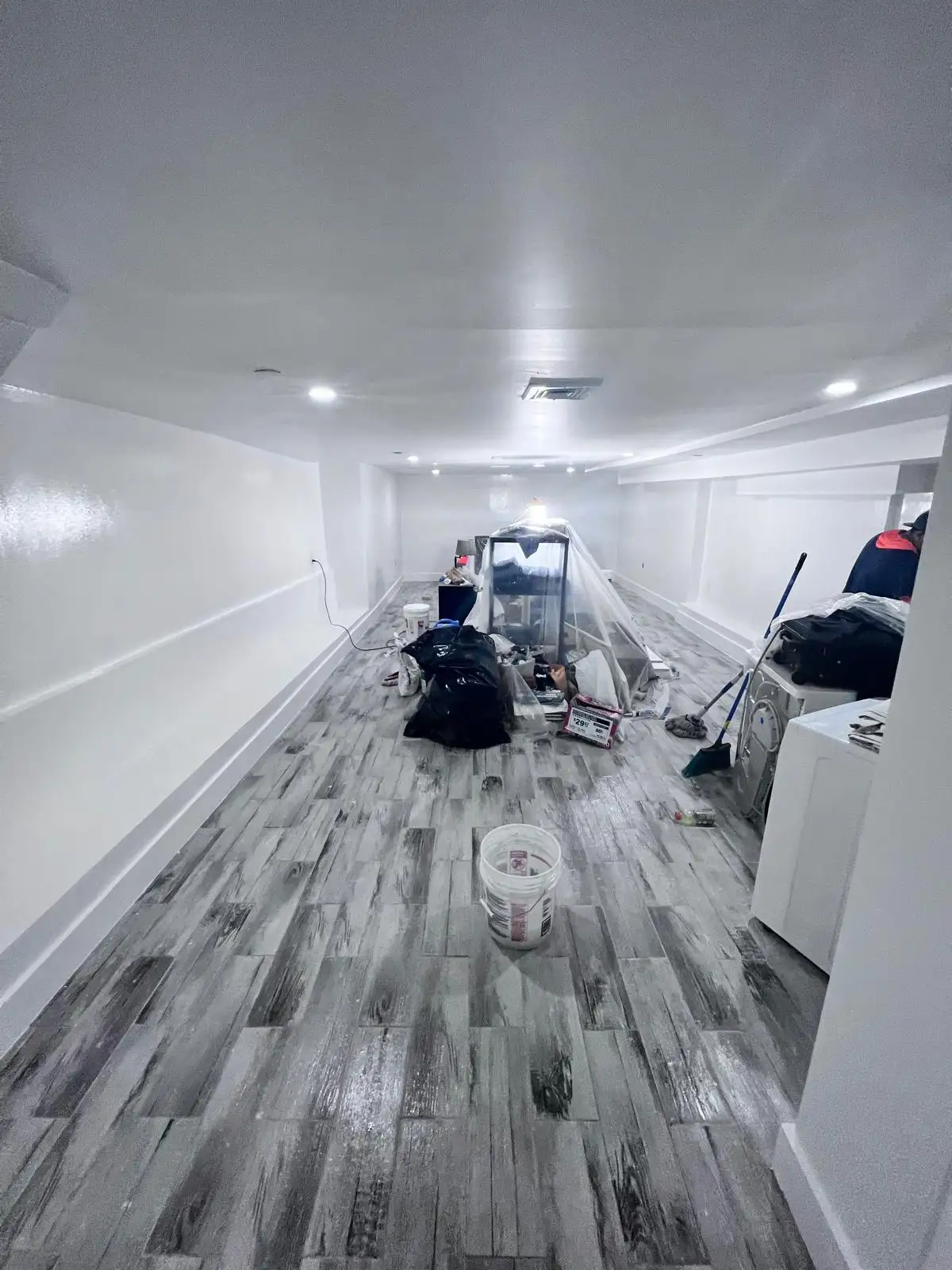 Crew painting basement — Bedford-Stuyvesant, Brooklyn