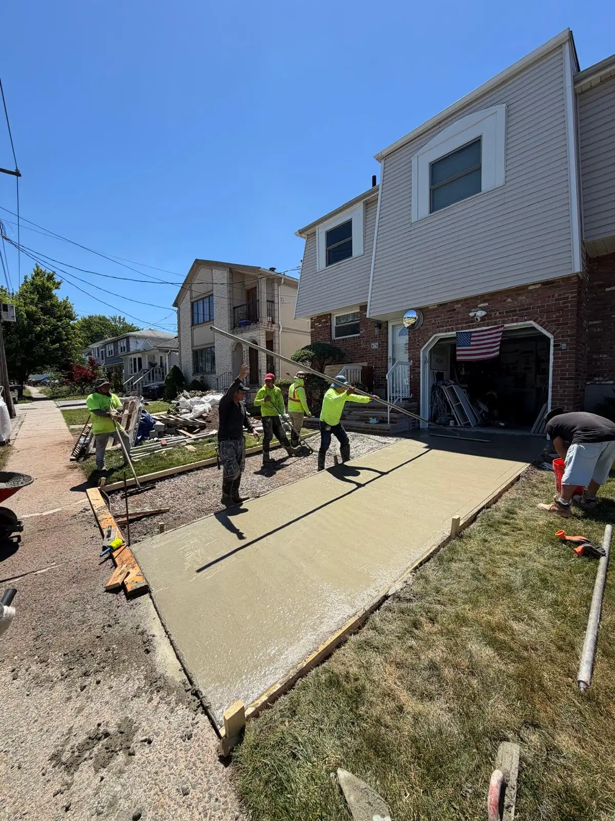 Crew placing new concrete walkway — Emerson Hill, Staten Island