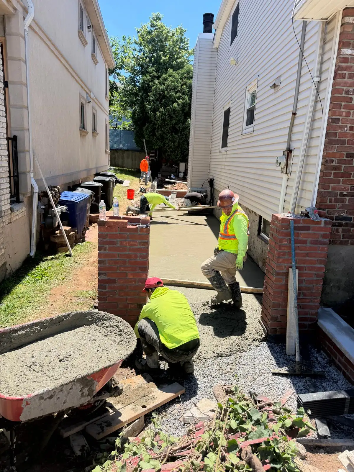 Crew pouring concrete walkway — Emerson Hill, Staten Island