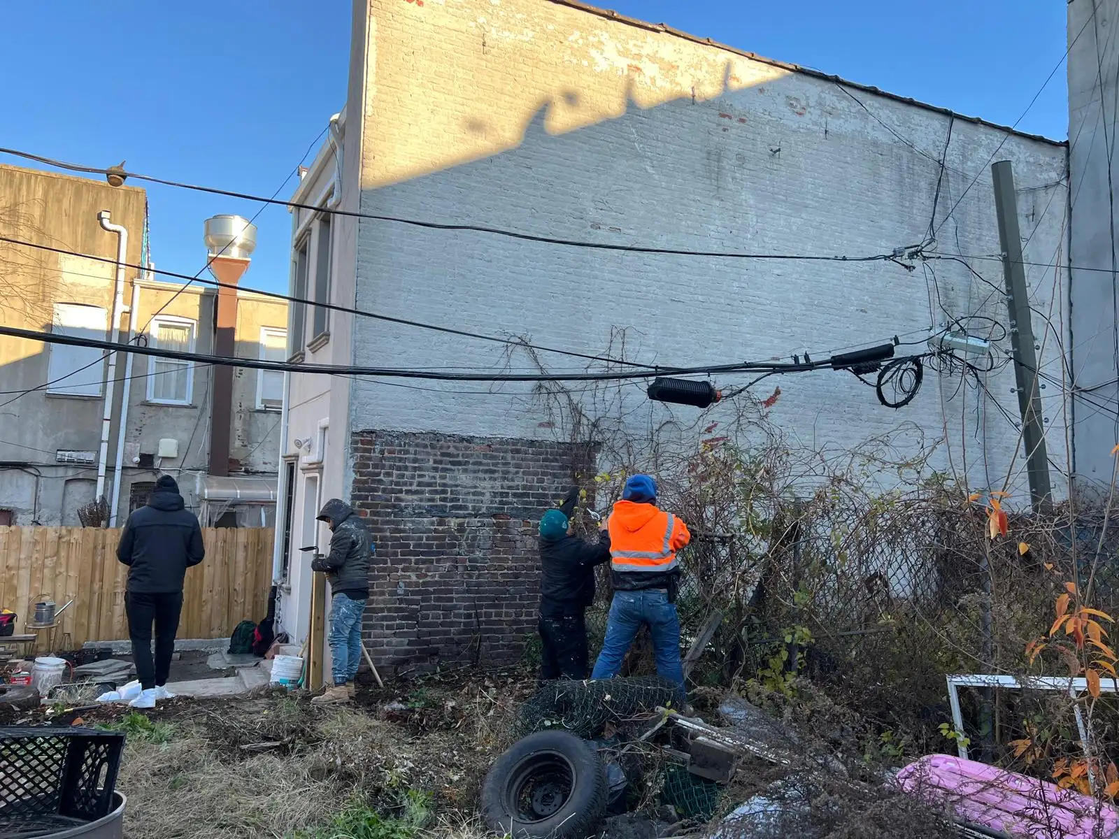 Crew preparing wall surfaces — East New York, Brooklyn