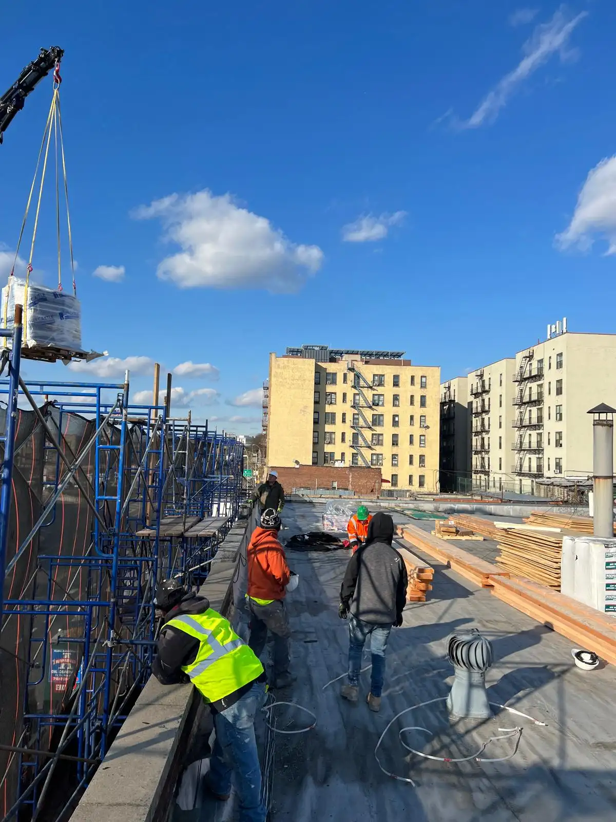 Crew receiving materials by crane — Hunts Point, Bronx