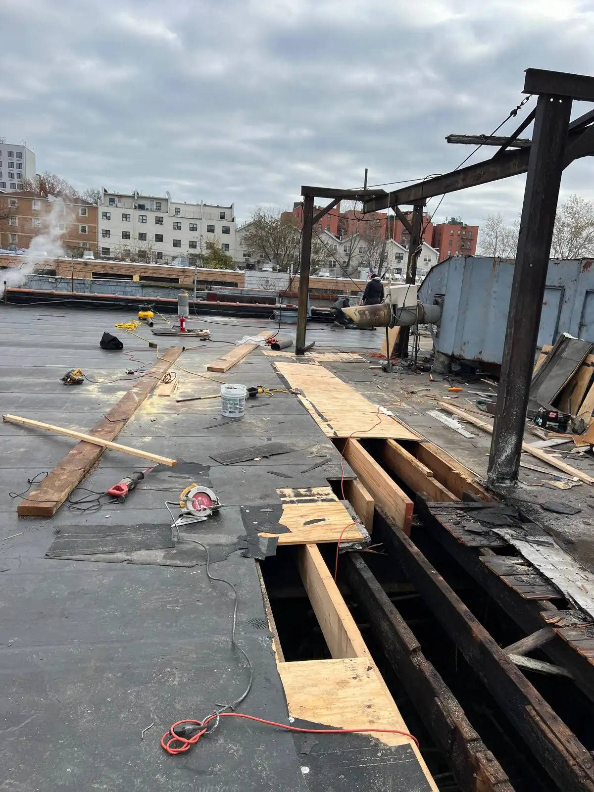 Damaged roof section removal — Hunts Point, Bronx