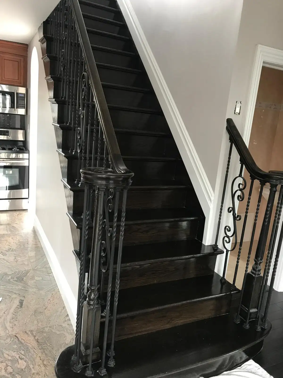 Dark wood staircase with iron balusters — Great Kills, Staten Island