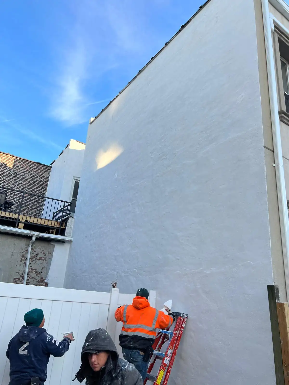 Finished elastomeric coated wall — East New York, Brooklyn
