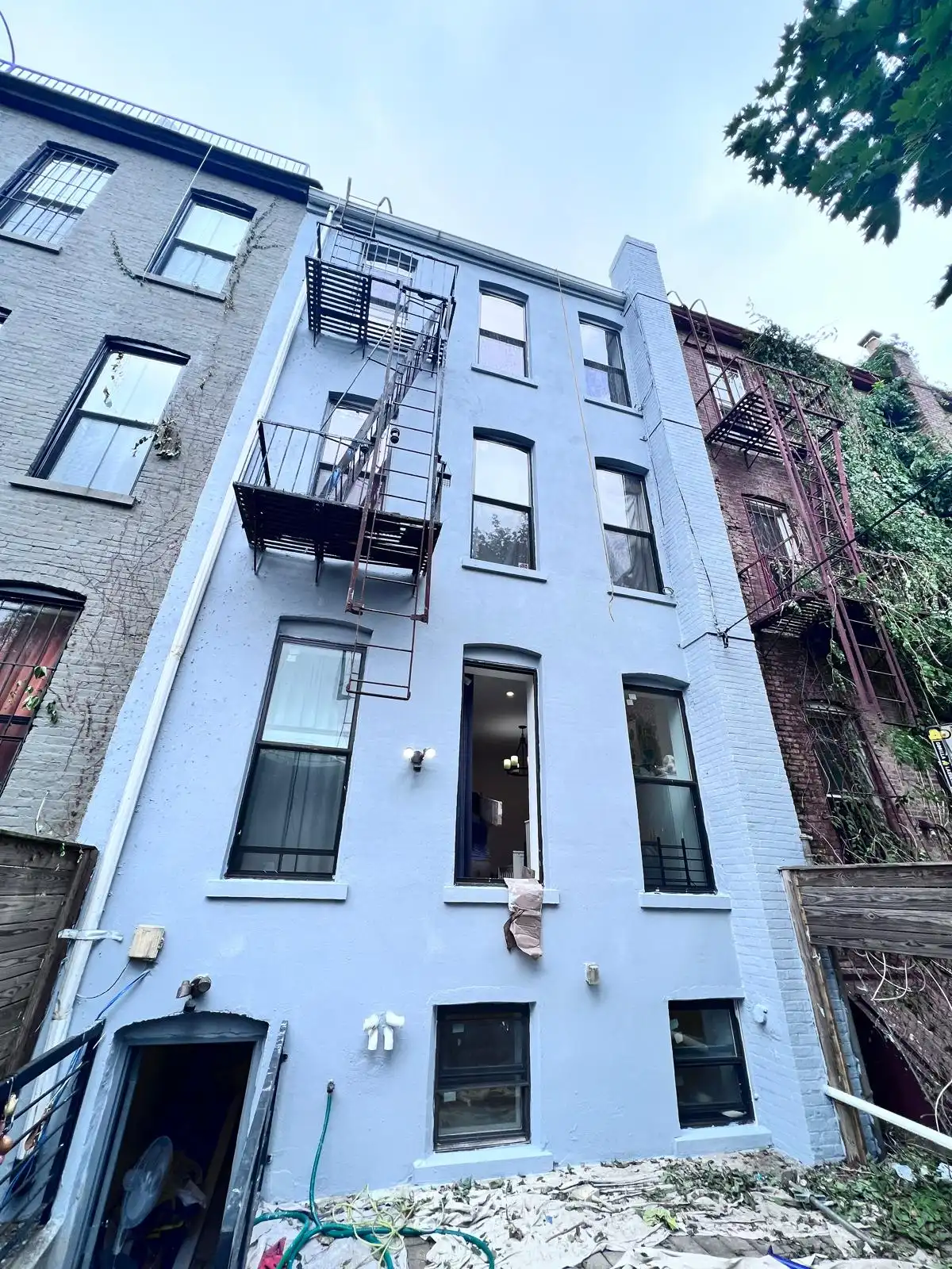 Finished rear facade with elastomeric coating — Bath Beach, Brooklyn