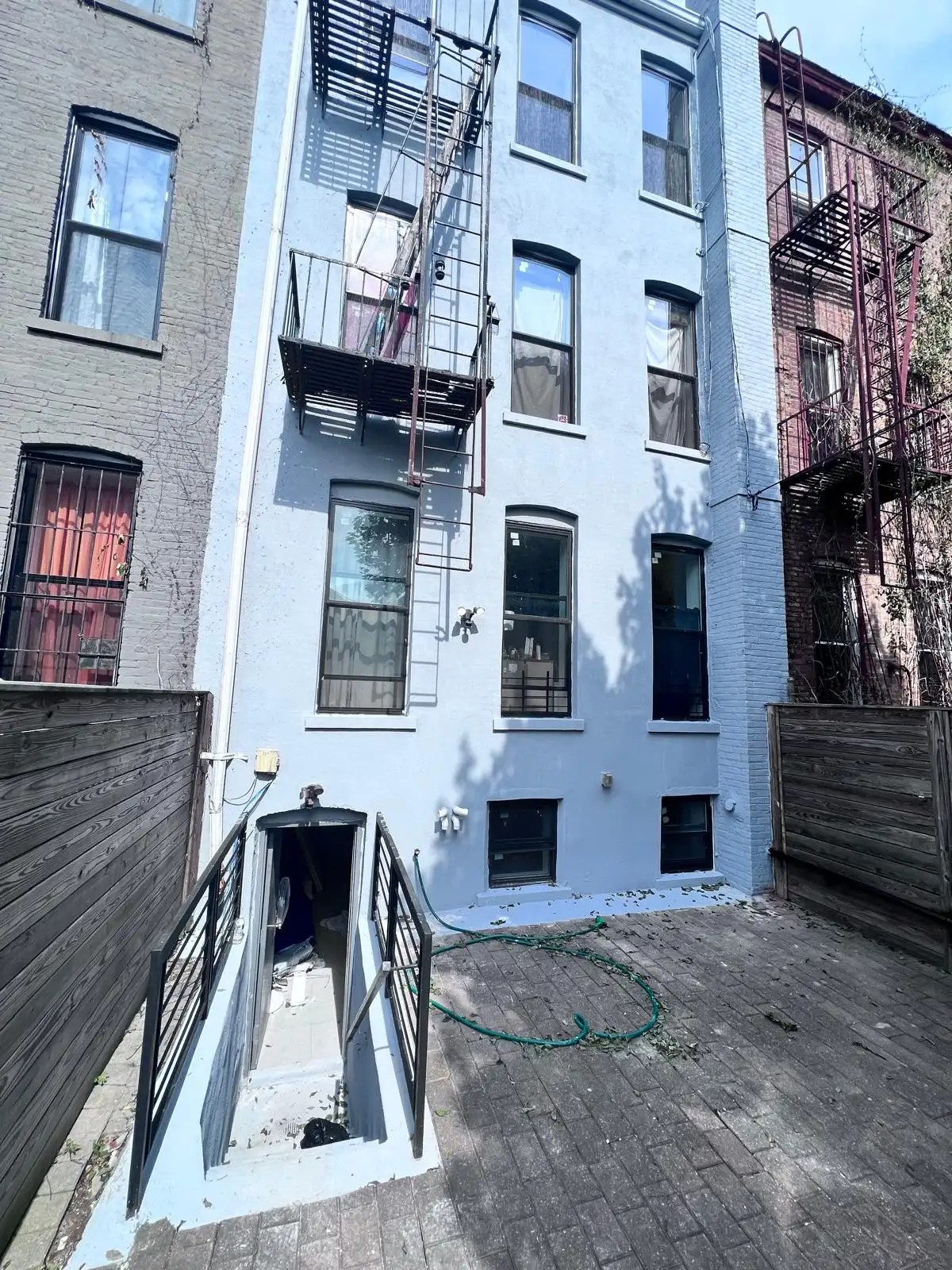 Finished rear wall with stucco — Bath Beach, Brooklyn