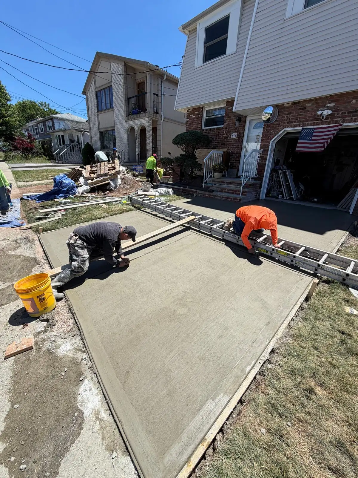 Finishing new concrete driveway — Emerson Hill, Staten Island
