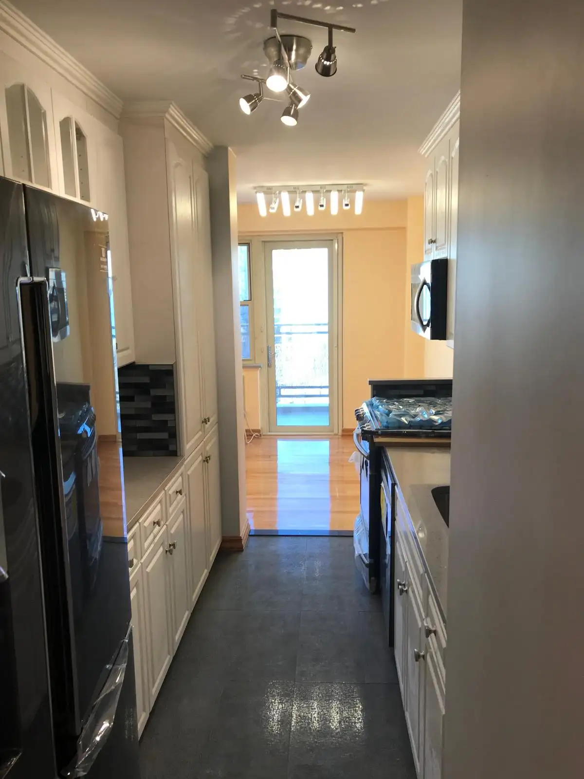 Galley kitchen with stainless appliances — Brighton Beach, Brooklyn