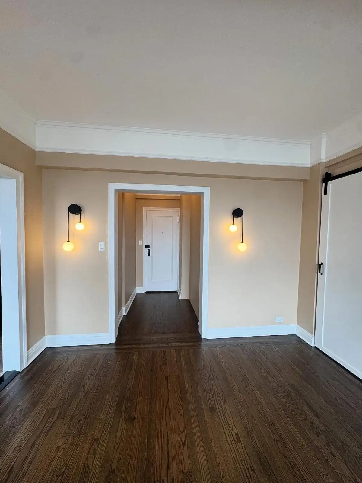 Hallway with wall sconces and refinished hardwood floor — Arrochar, Staten Island