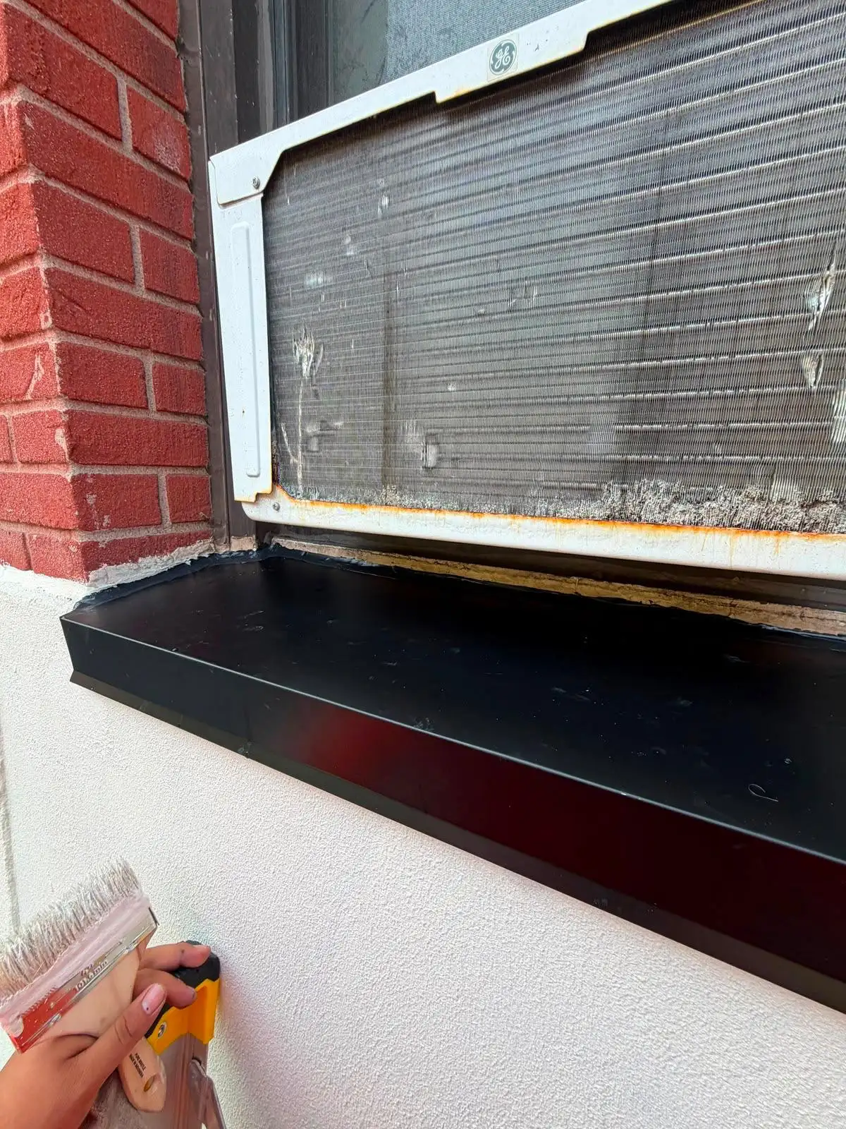 Installing new metal windowsill — Upper West Side, Manhattan