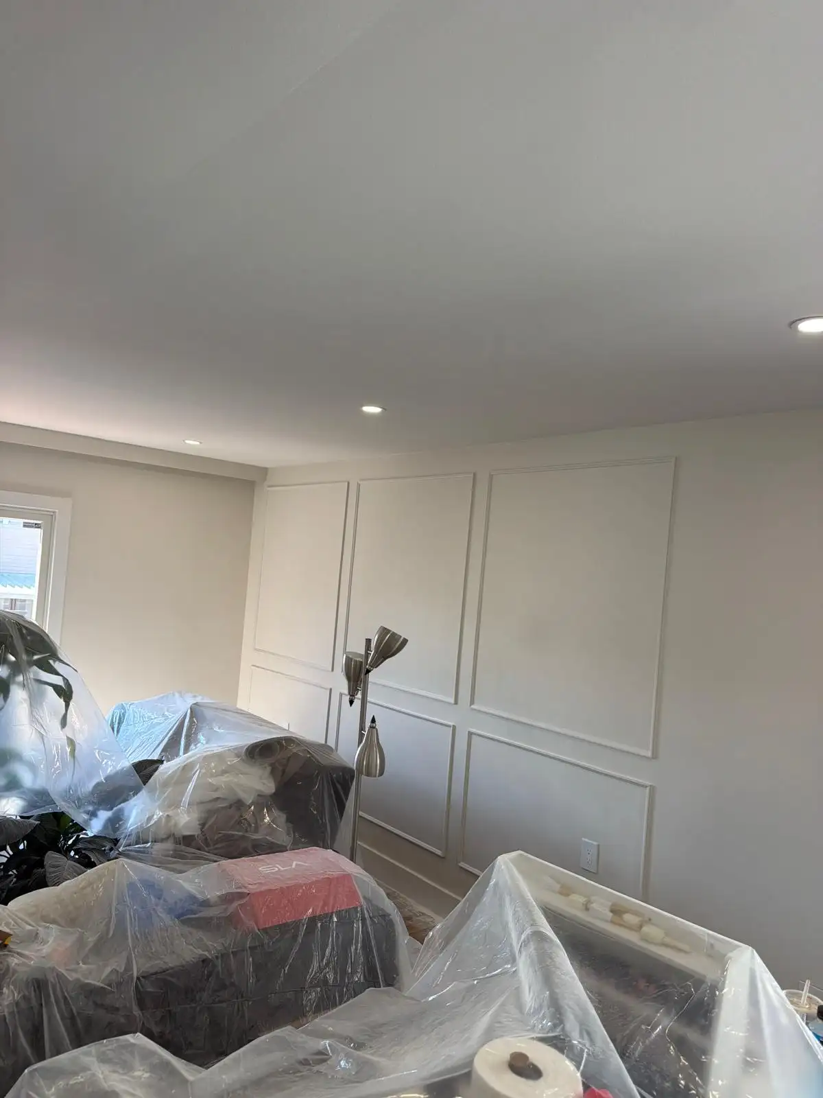 Living room wall molding during painting prep — Bath Beach, Brooklyn
