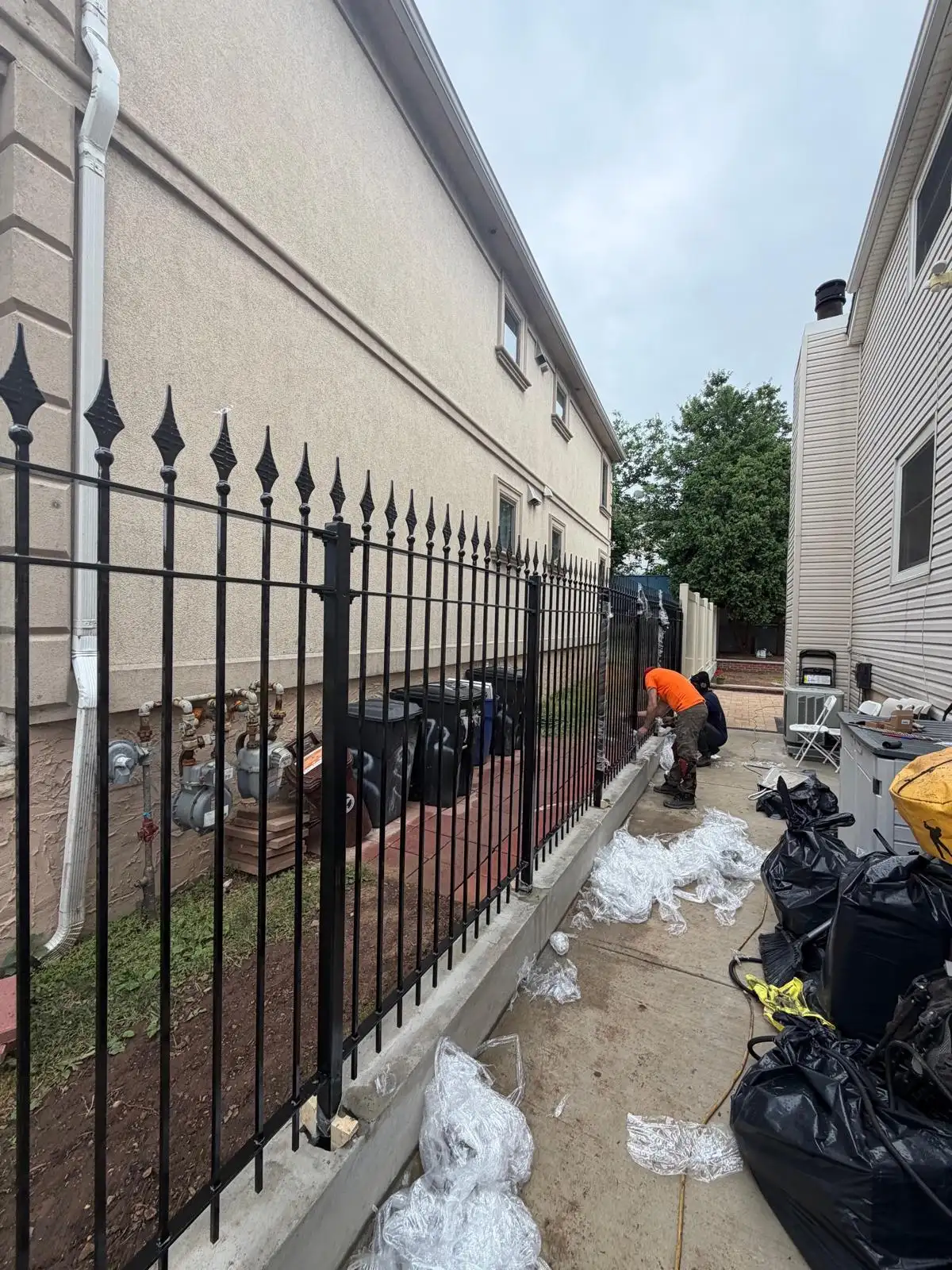 Metal picket fence installation — Emerson Hill, Staten Island