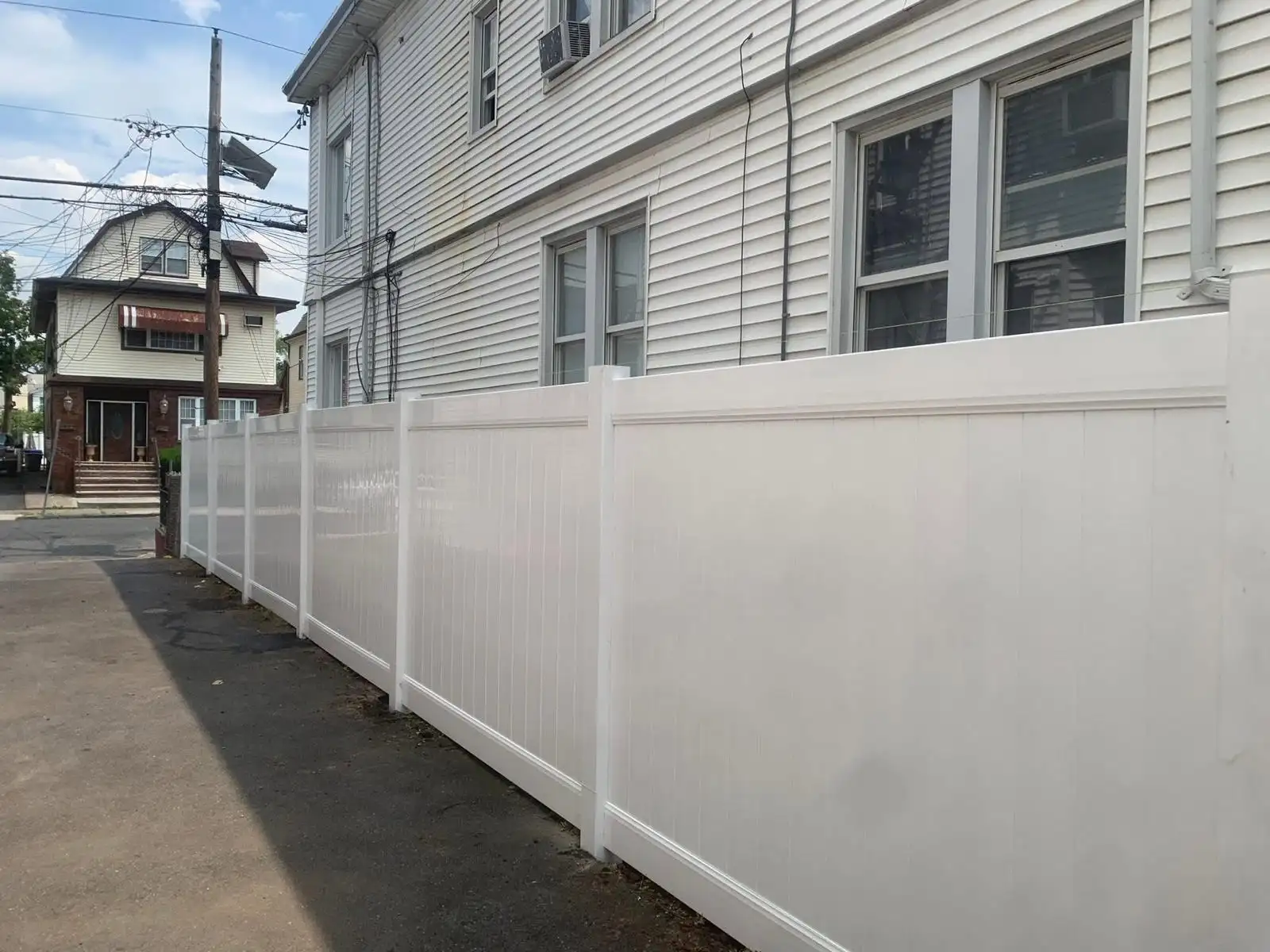 New 6 ft white PVC privacy fence along driveway — Arrochar, Staten Island