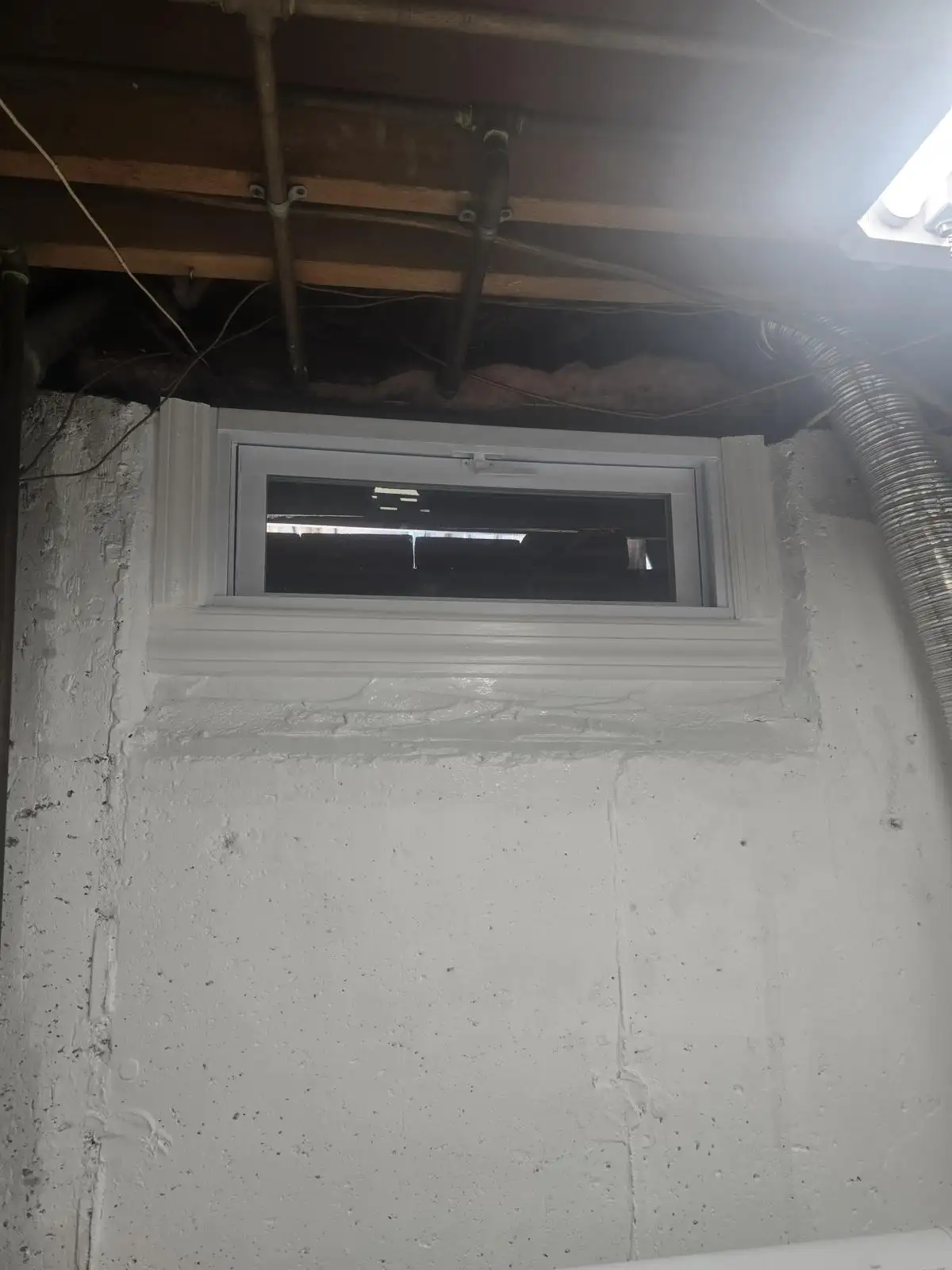 New basement window in unfinished basement — Eltingville, Staten Island