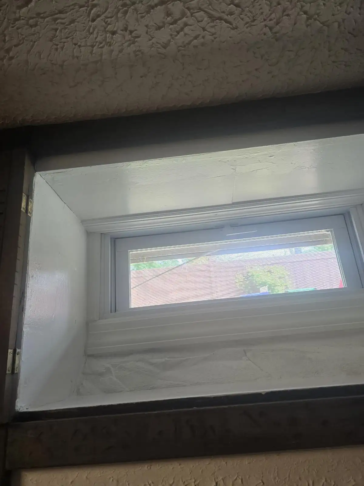 New basement window with sealed white frame — Eltingville, Staten Island