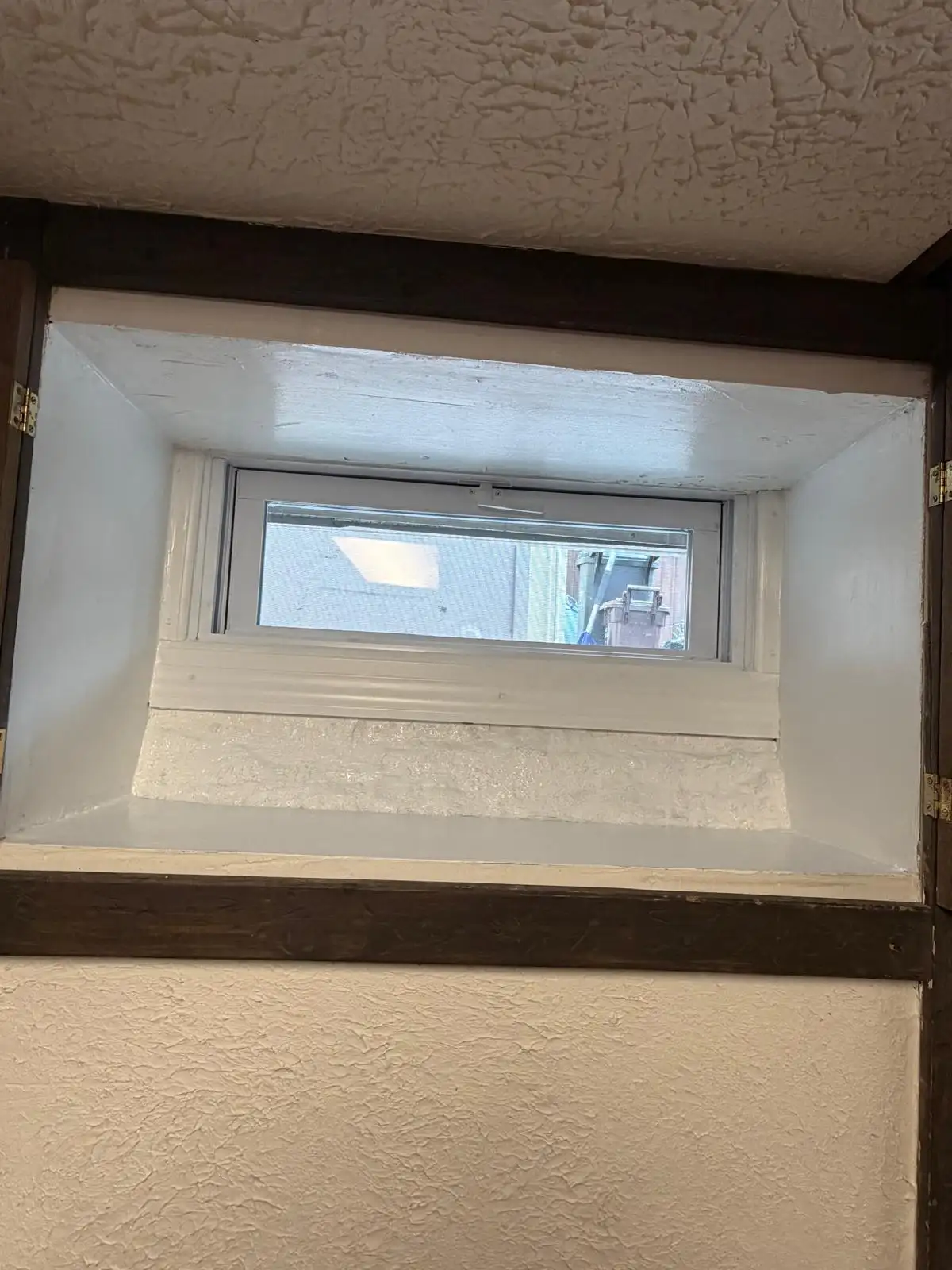 New basement window with wrapped sill — Eltingville, Staten Island