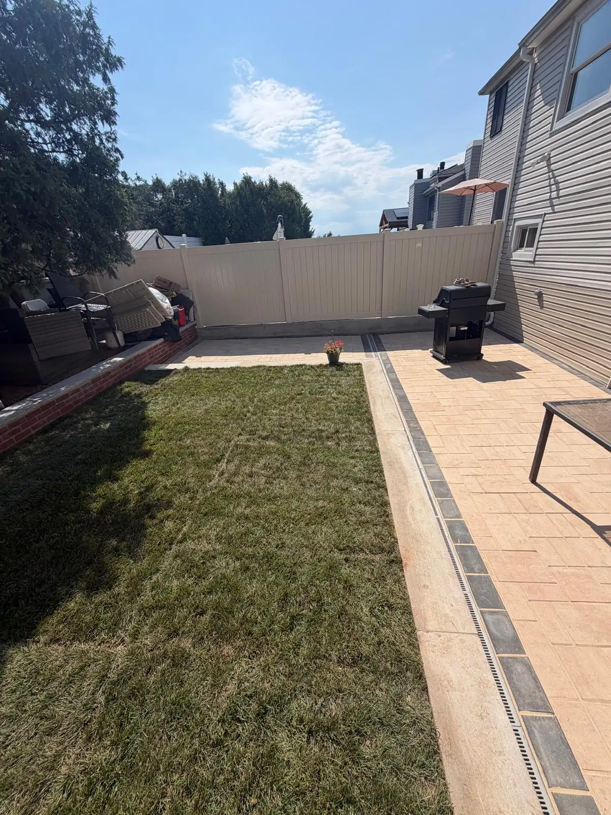 New lawn with paver border in backyard — Emerson Hill, Staten Island