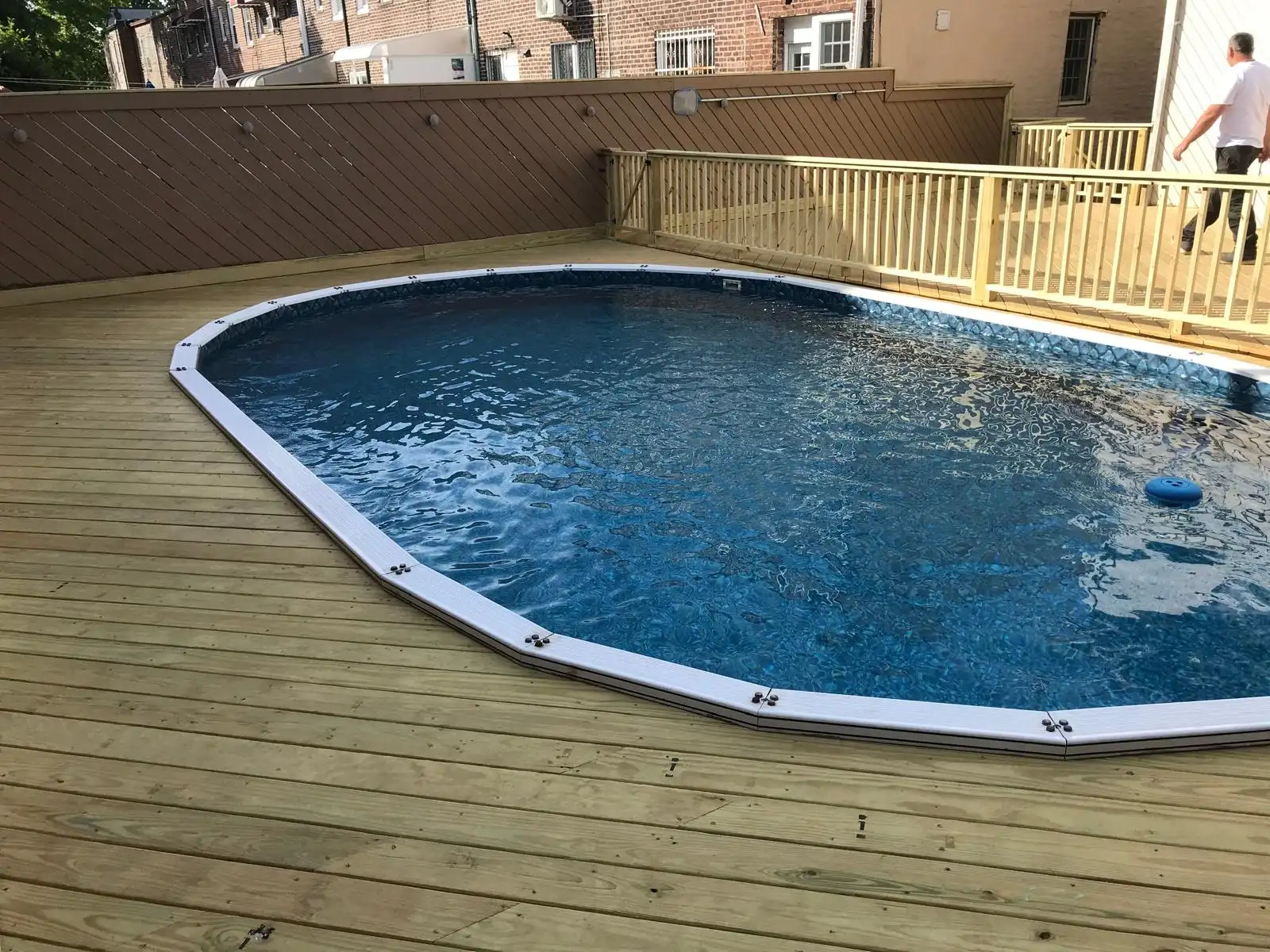 New pool deck around above ground pool — Dyker Heights, Brooklyn
