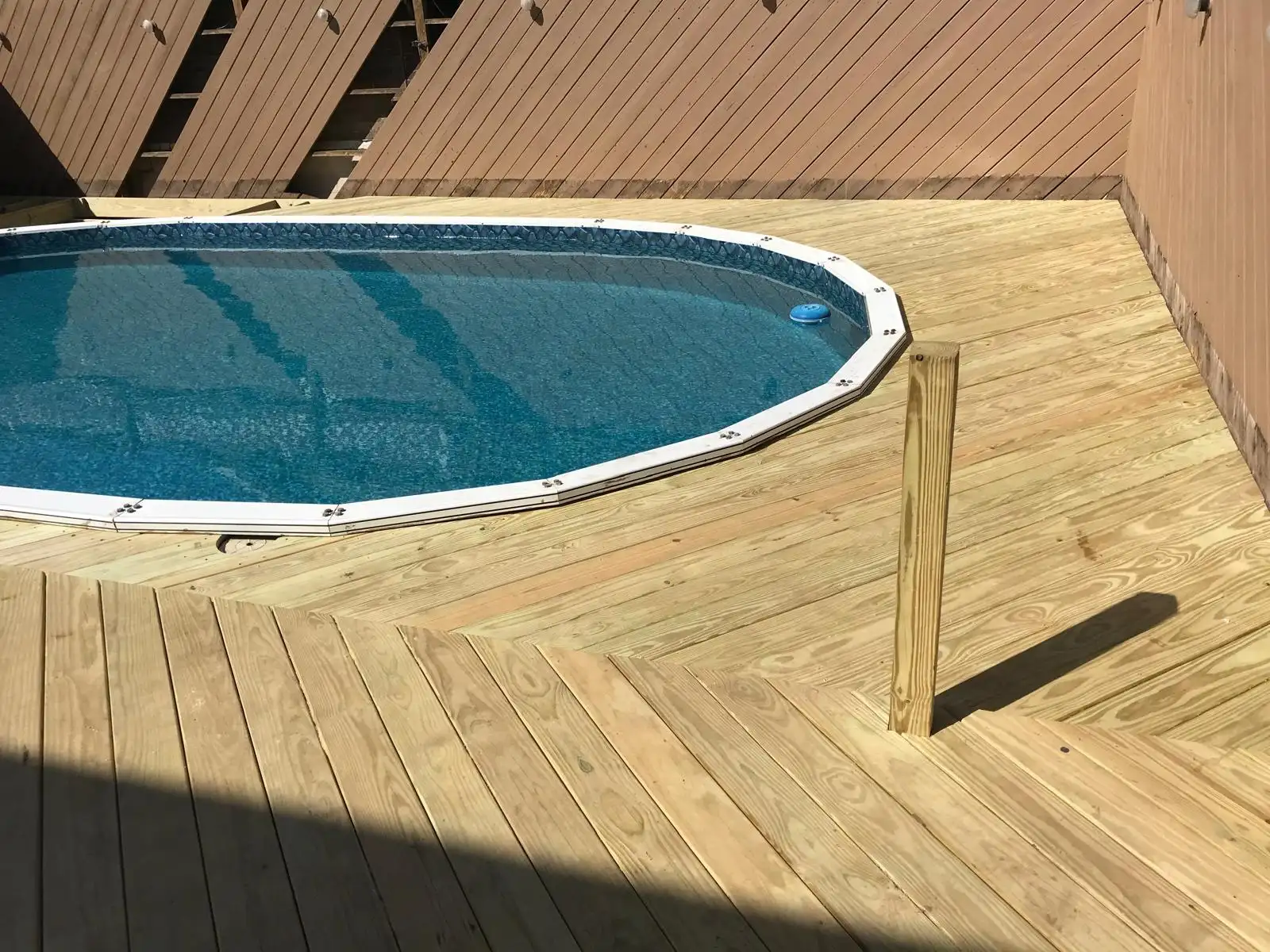 New pressure treated deck around pool — Dyker Heights, Brooklyn