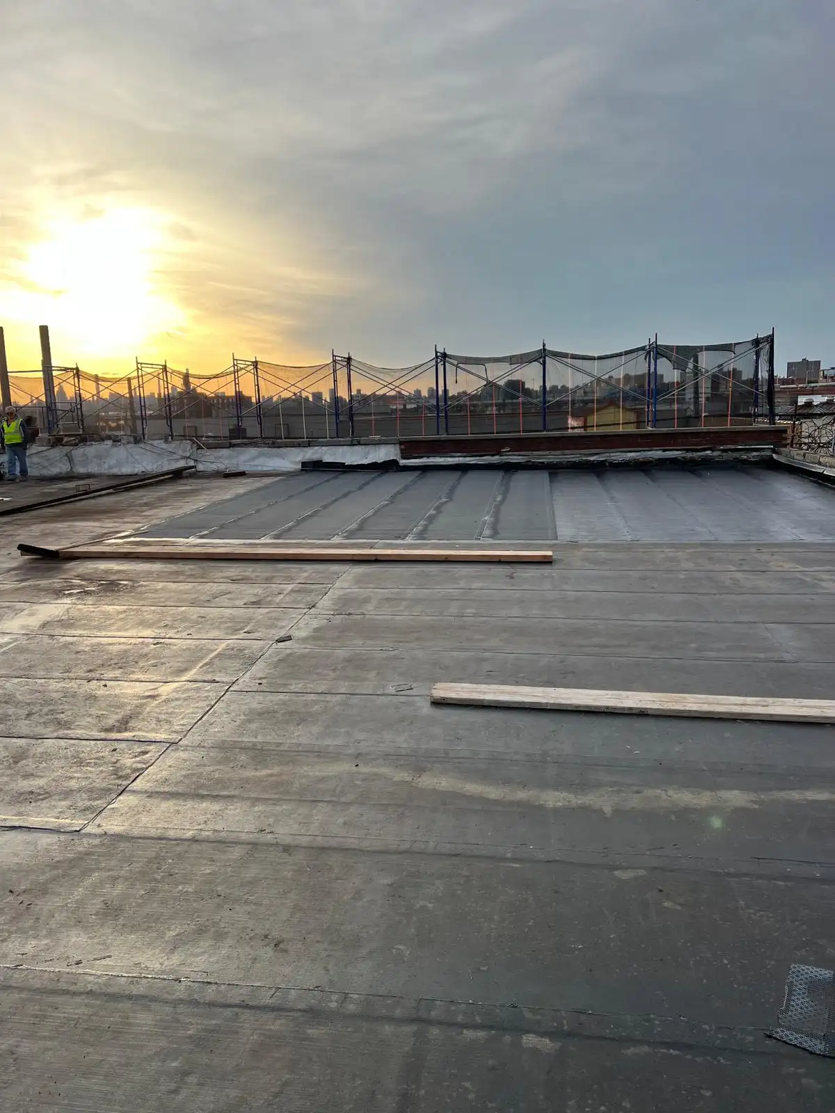 New roof surface at sunset — Hunts Point, Bronx