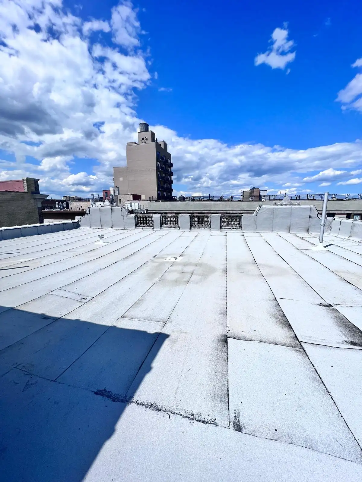 New SBS roof with white cap sheet — Washington Heights, Manhattan