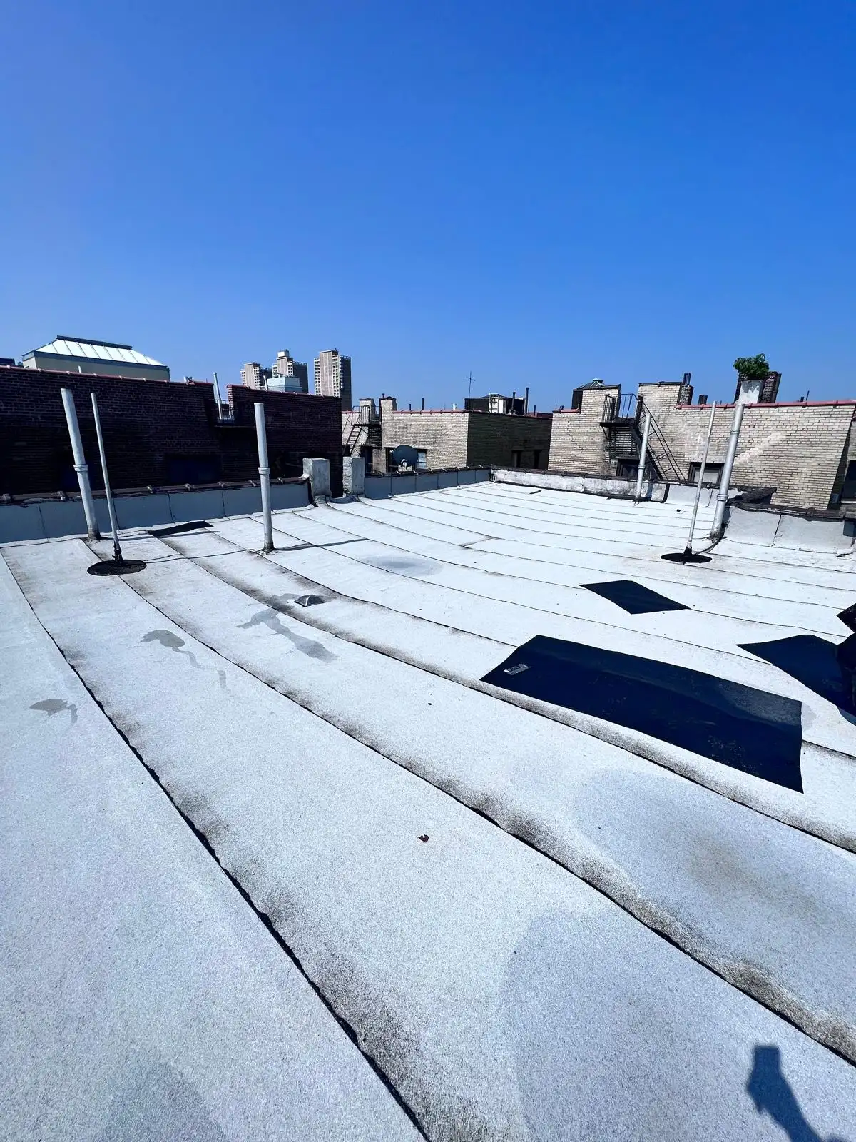 New white SBS roof with skylights — Washington Heights, Manhattan
