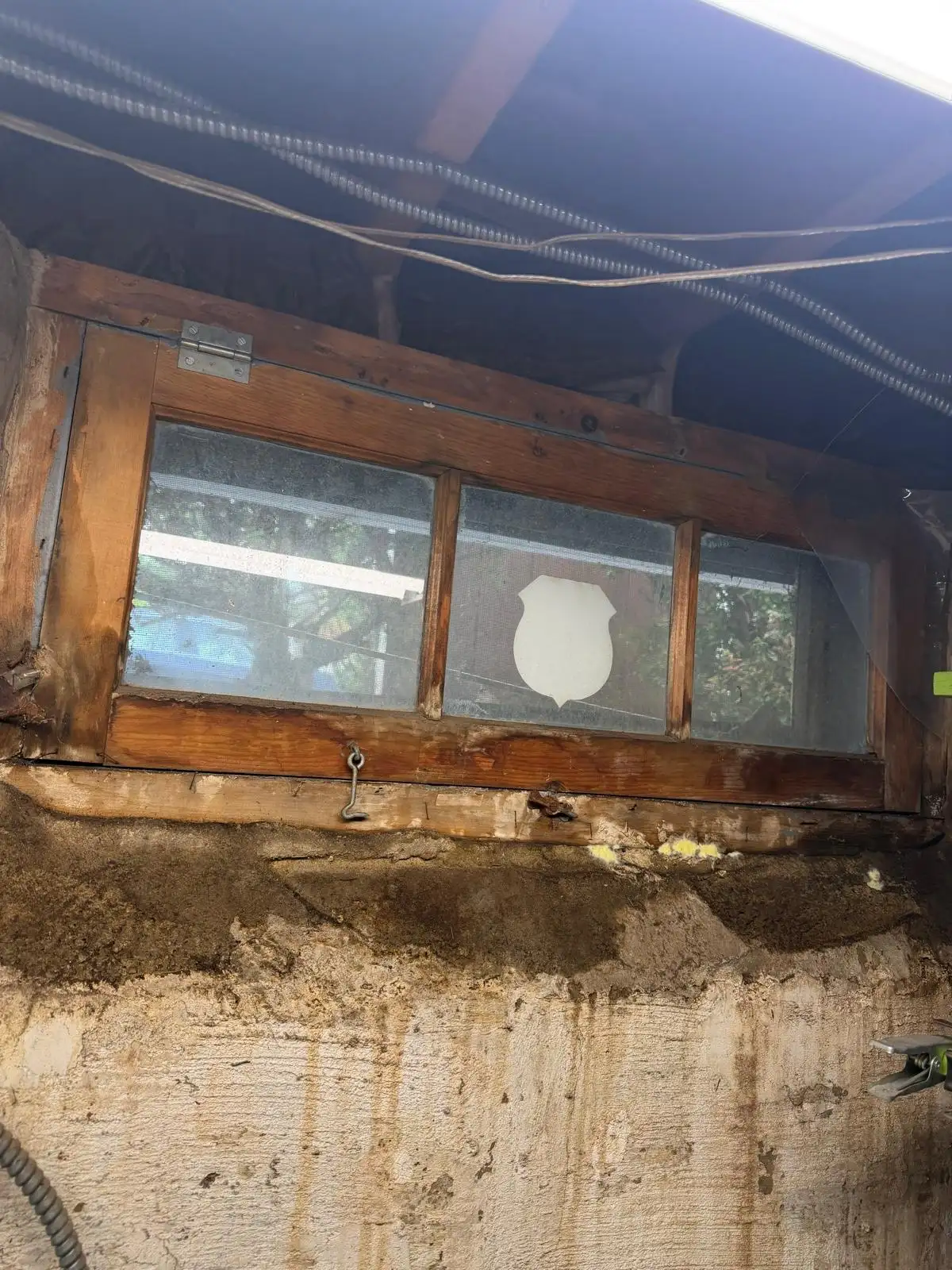 Old rotted wood basement window — Eltingville, Staten Island
