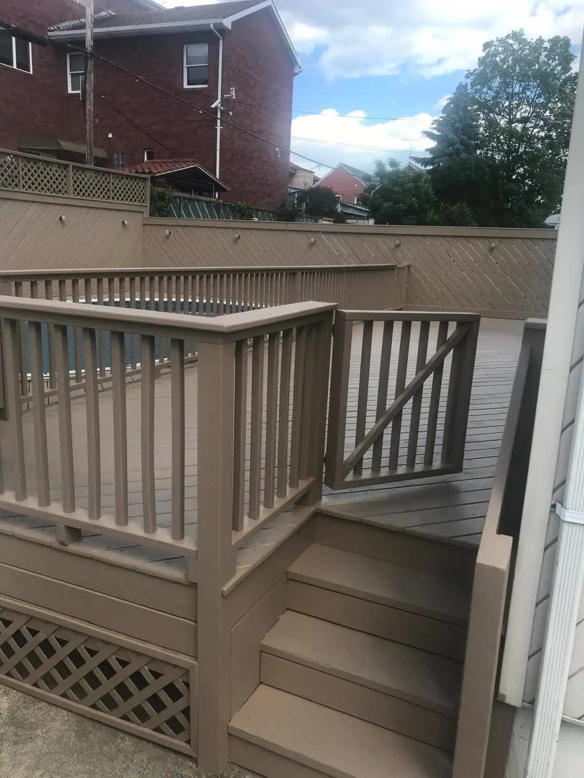 Painted deck stairs with lattice — Dyker Heights, Brooklyn