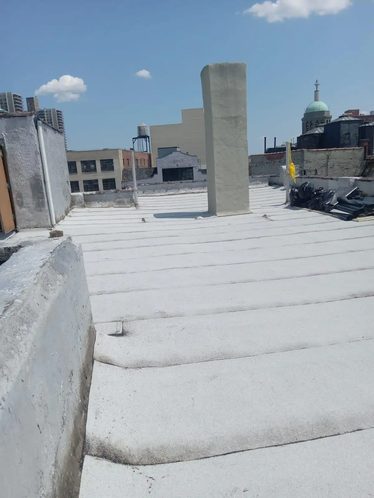 Parapet and chimney with new roofing — Washington Heights, Manhattan