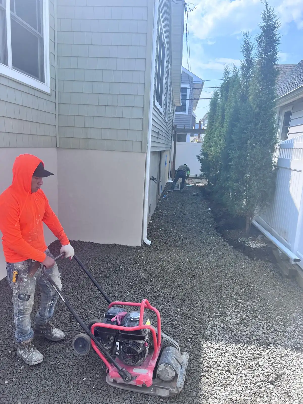 Plate compactor on gravel base — East Meadow, Long Island