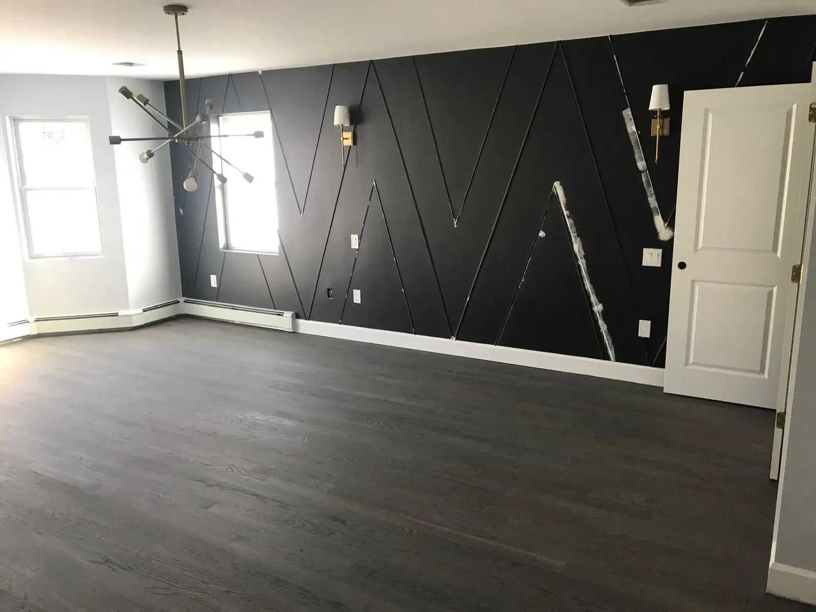 Renovated room with dark accent wall — Castleton Corners, Staten Island