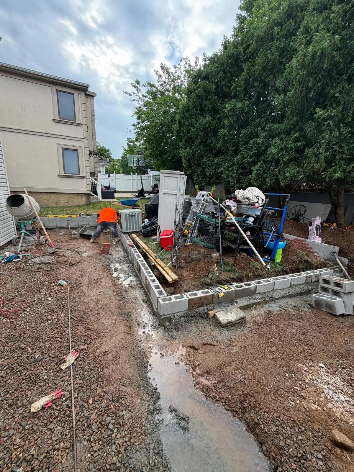 Retaining wall foundation in backyard — Emerson Hill, Staten Island