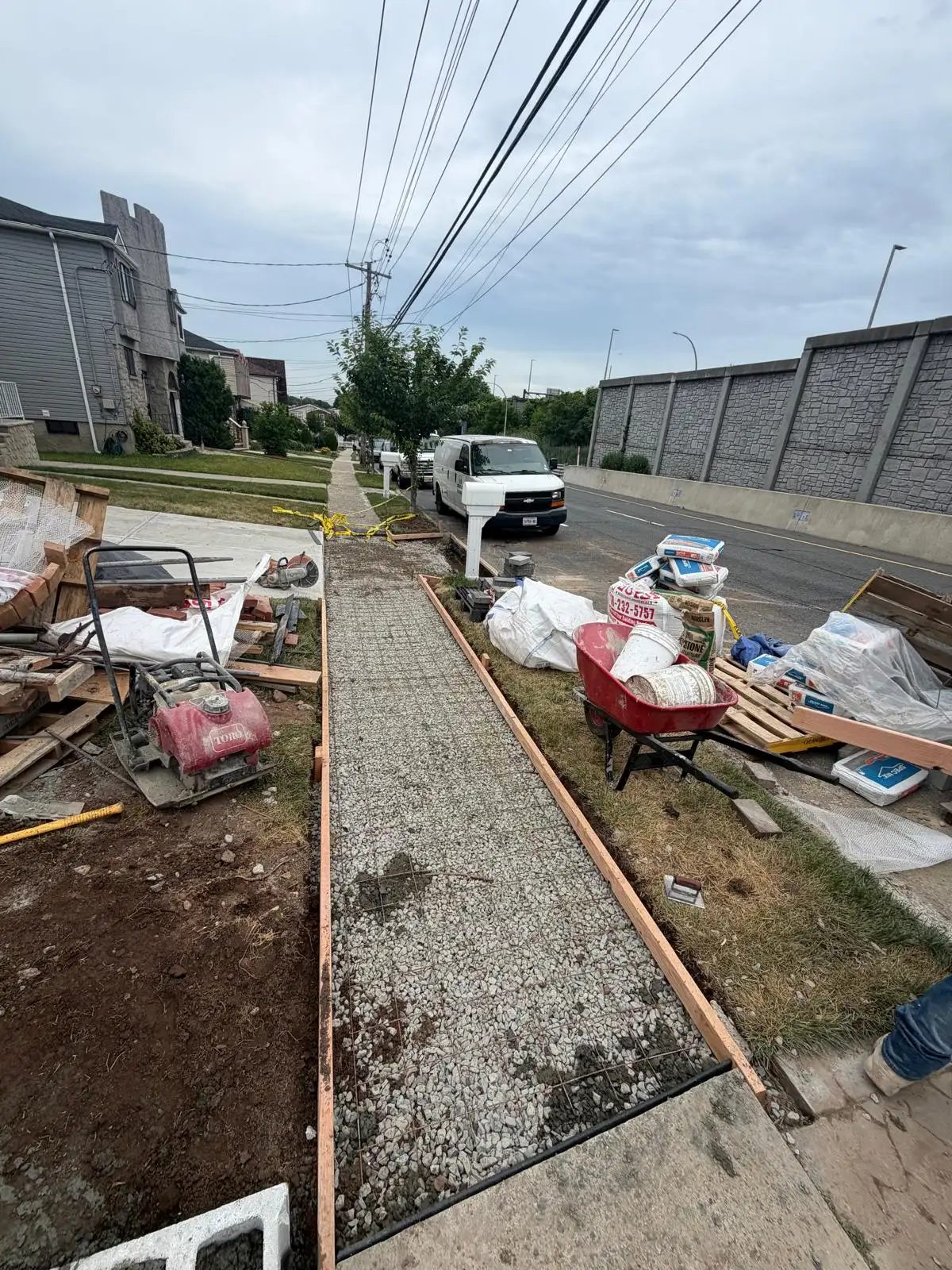 Sidewalk preparation for new concrete — Emerson Hill, Staten Island