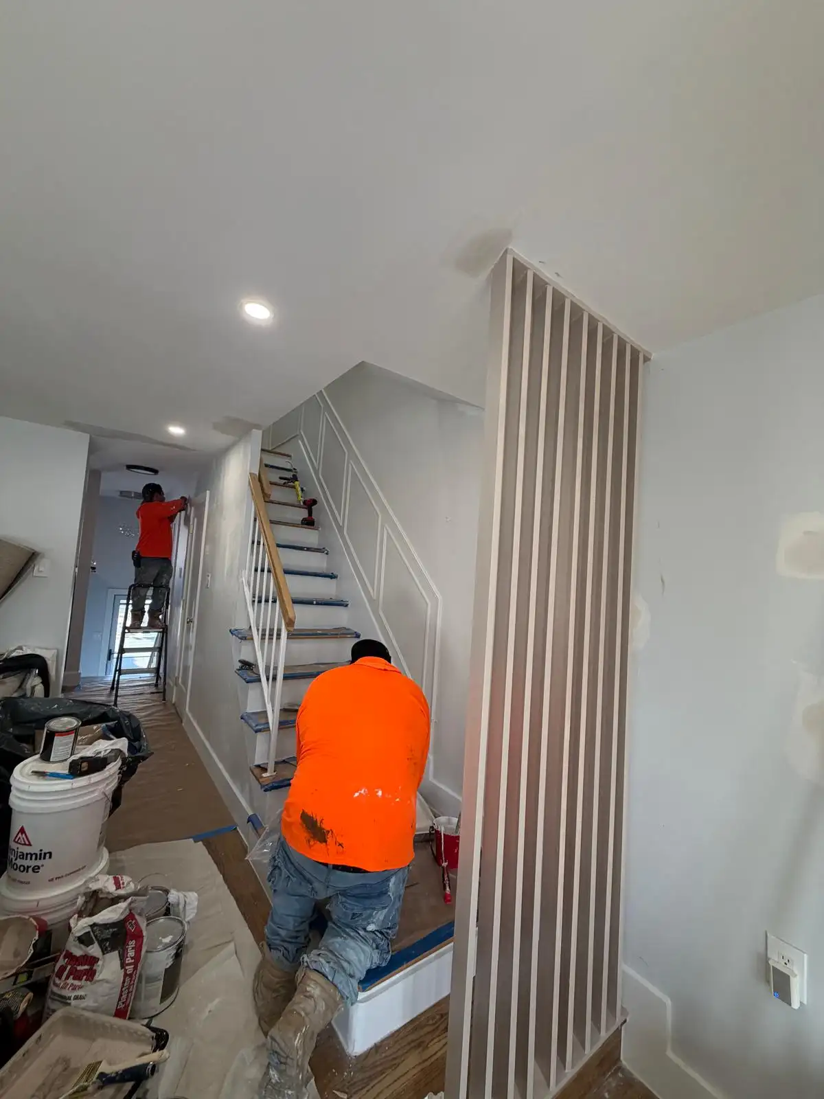 Slat accent wall and staircase trim in progress — Bath Beach, Brooklyn