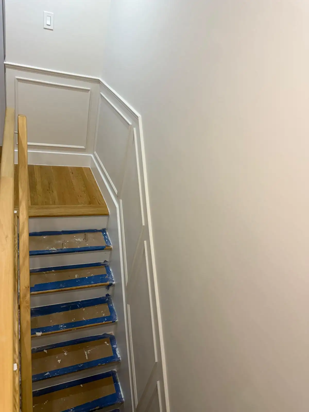 Staircase wainscoting with oak handrail — Bath Beach, Brooklyn