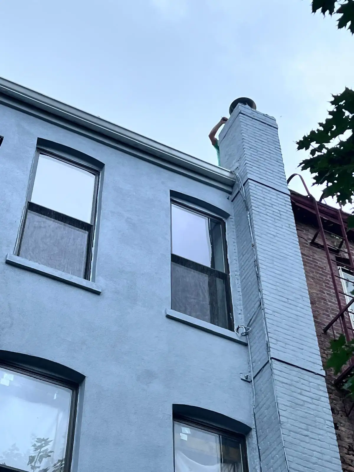 Stucco chimney and rear wall — Bath Beach, Brooklyn