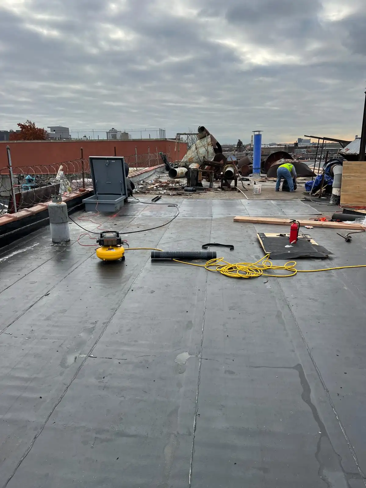 Torch-applied roofing in progress — Hunts Point, Bronx