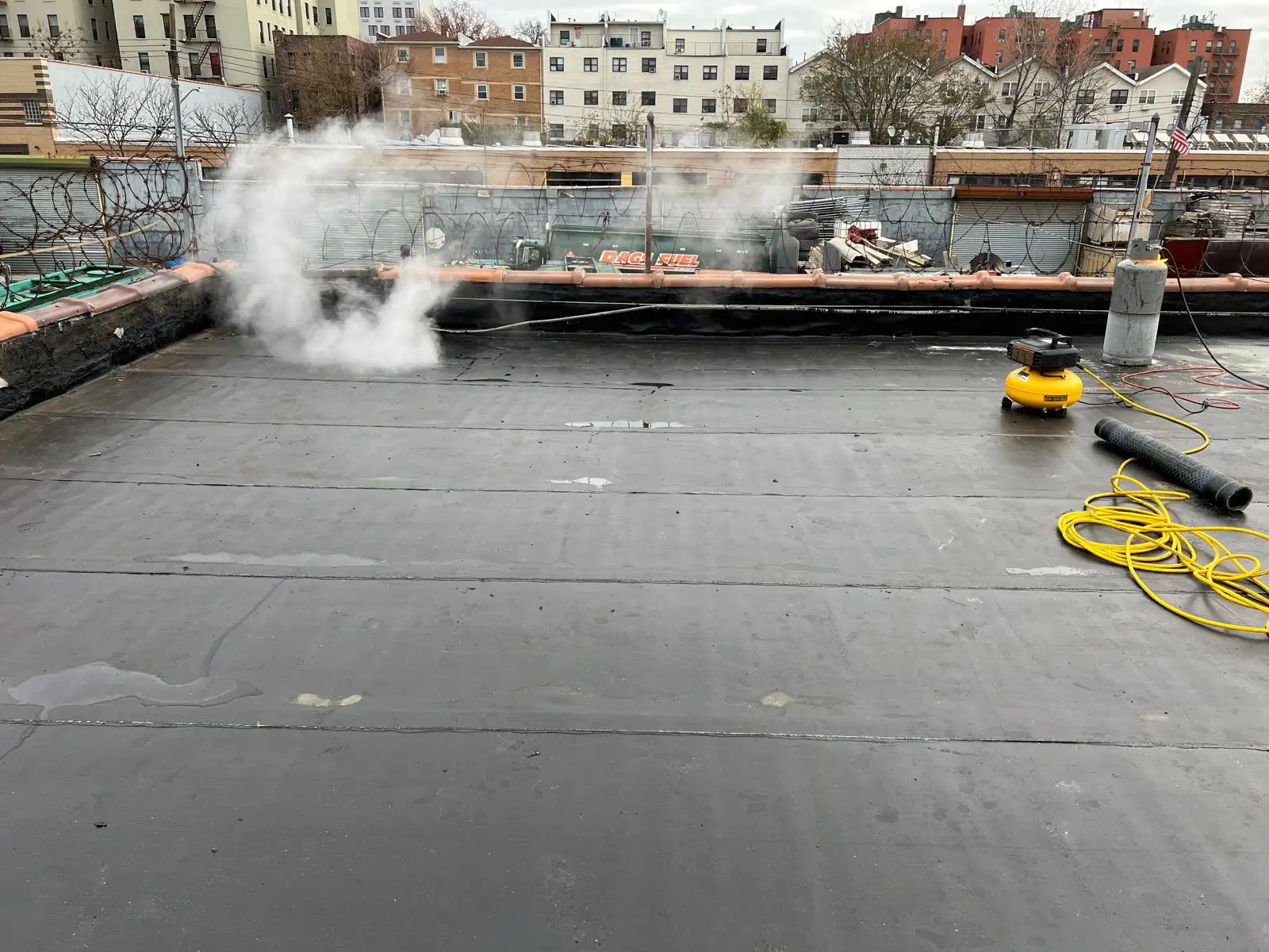 Torch steam on new roof membrane — Hunts Point, Bronx