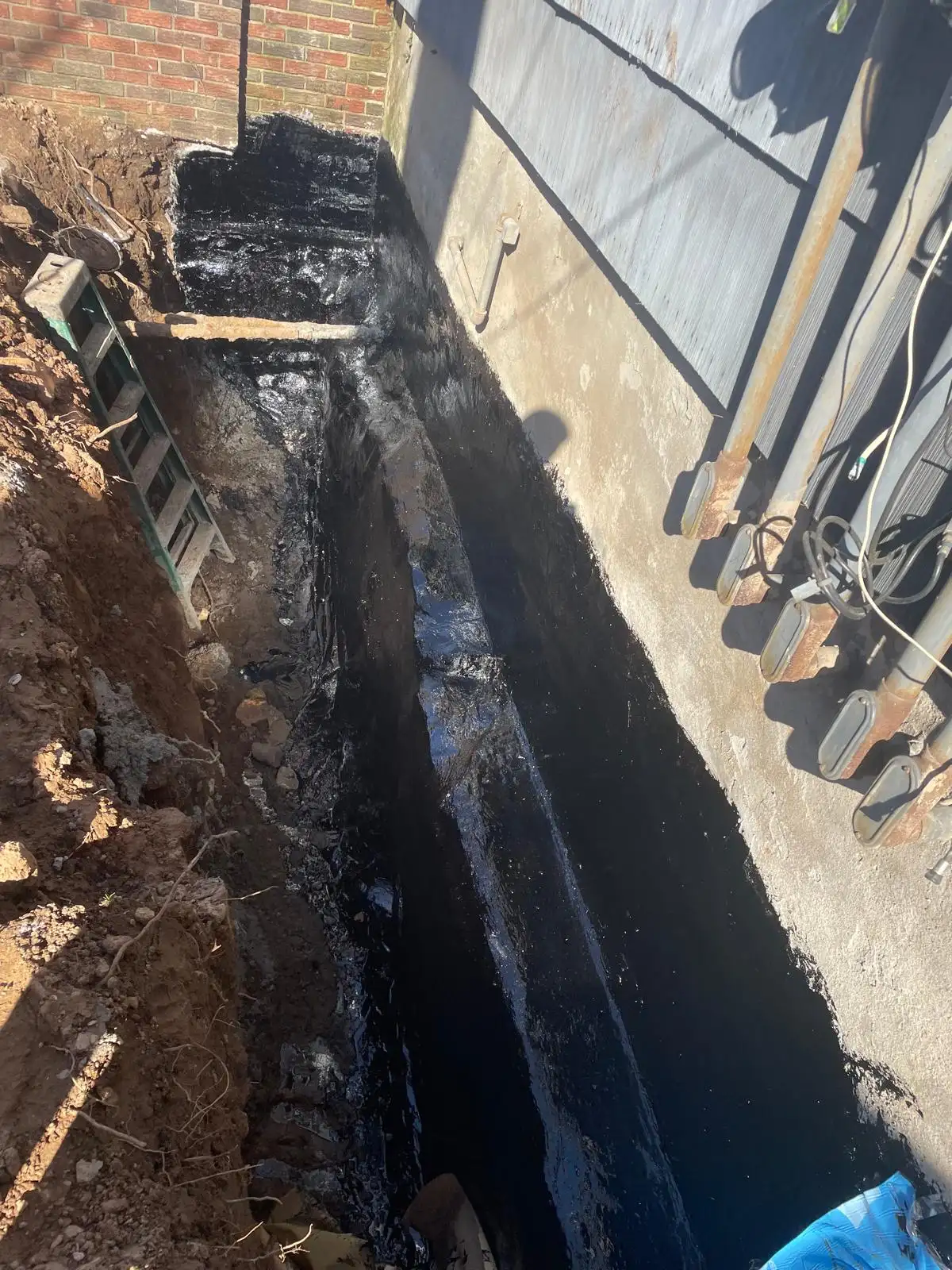 Trench with black waterproofing — Stapleton, Staten Island